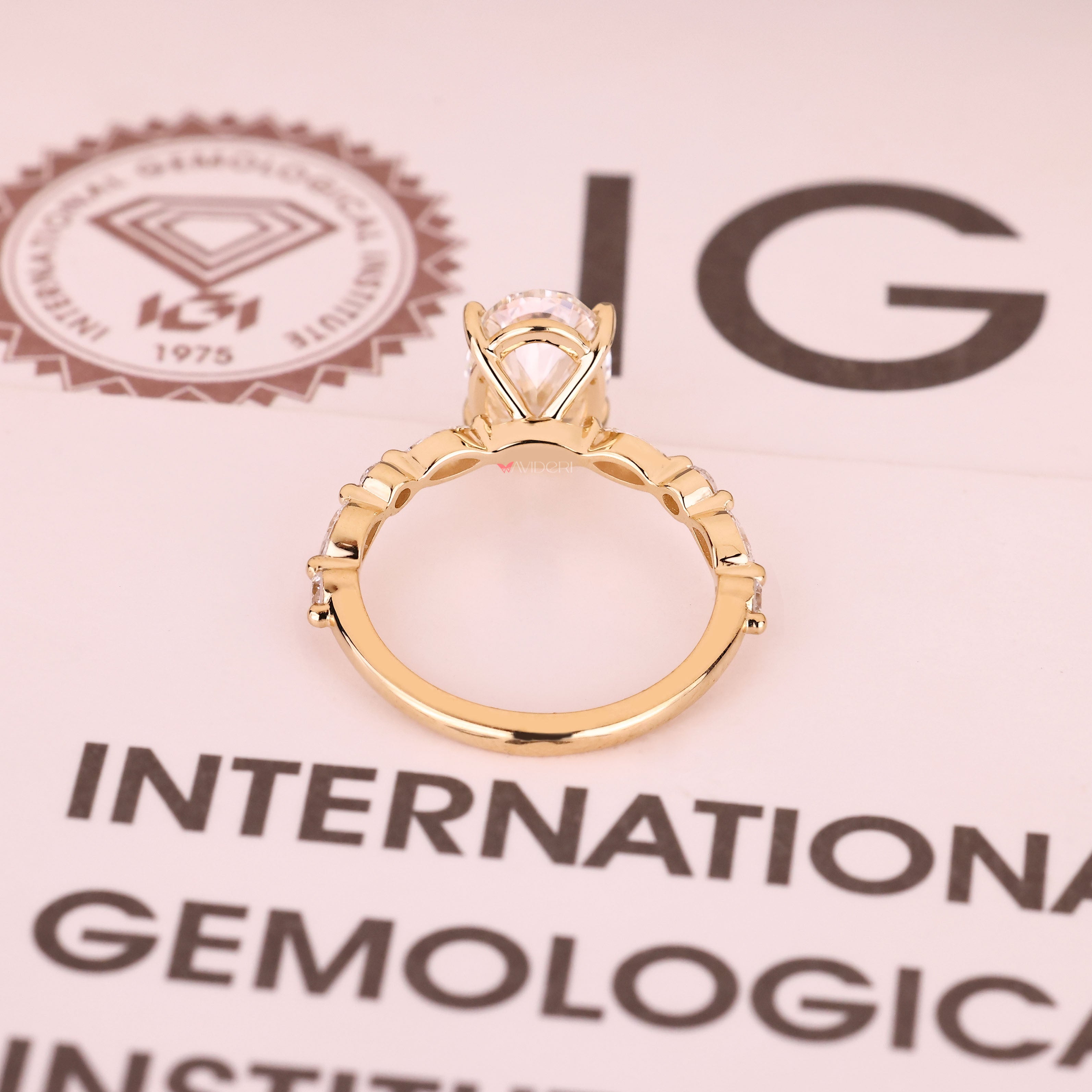 Handmade oval diamond ring with shared prong pave design

