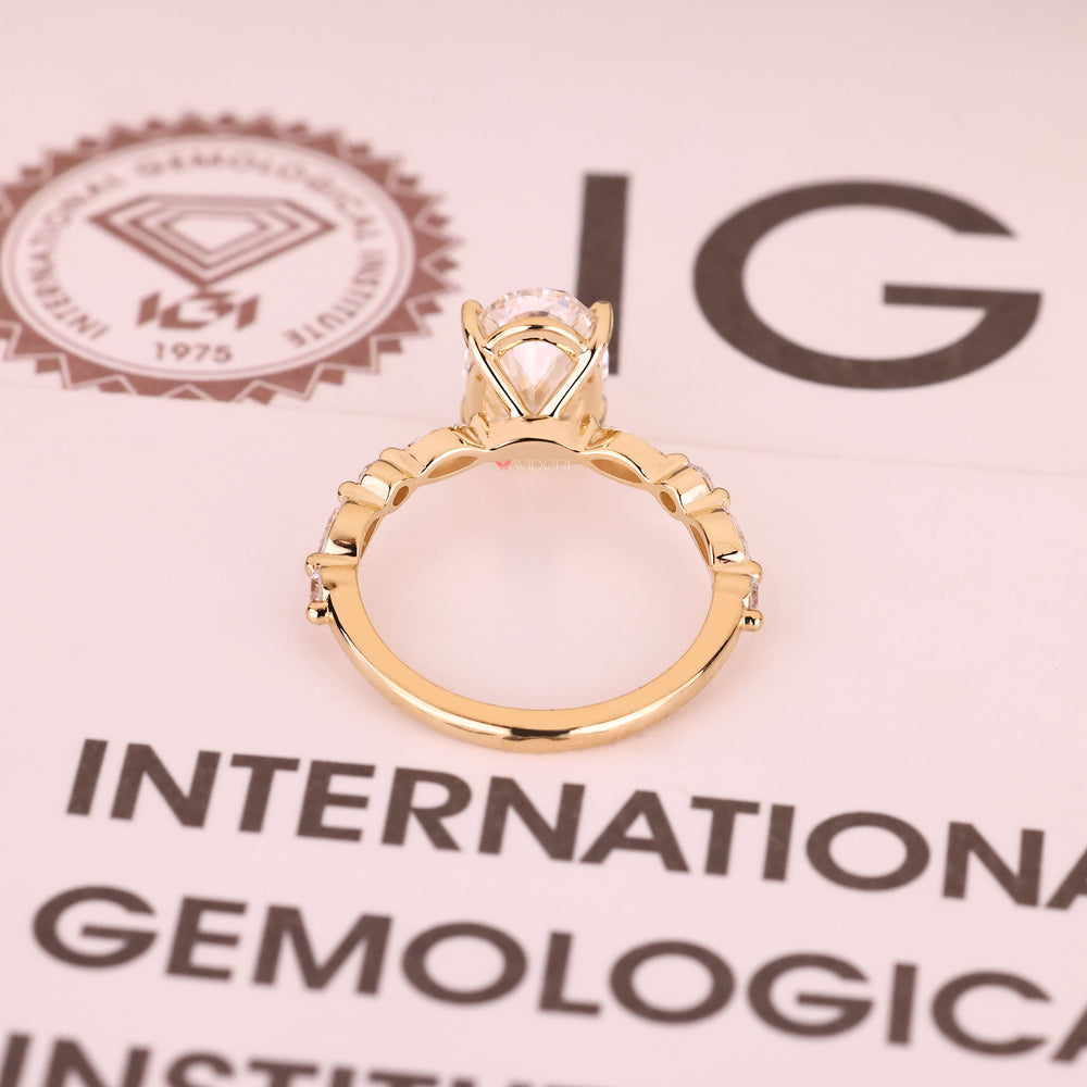 Handmade oval diamond ring with shared prong pave design
