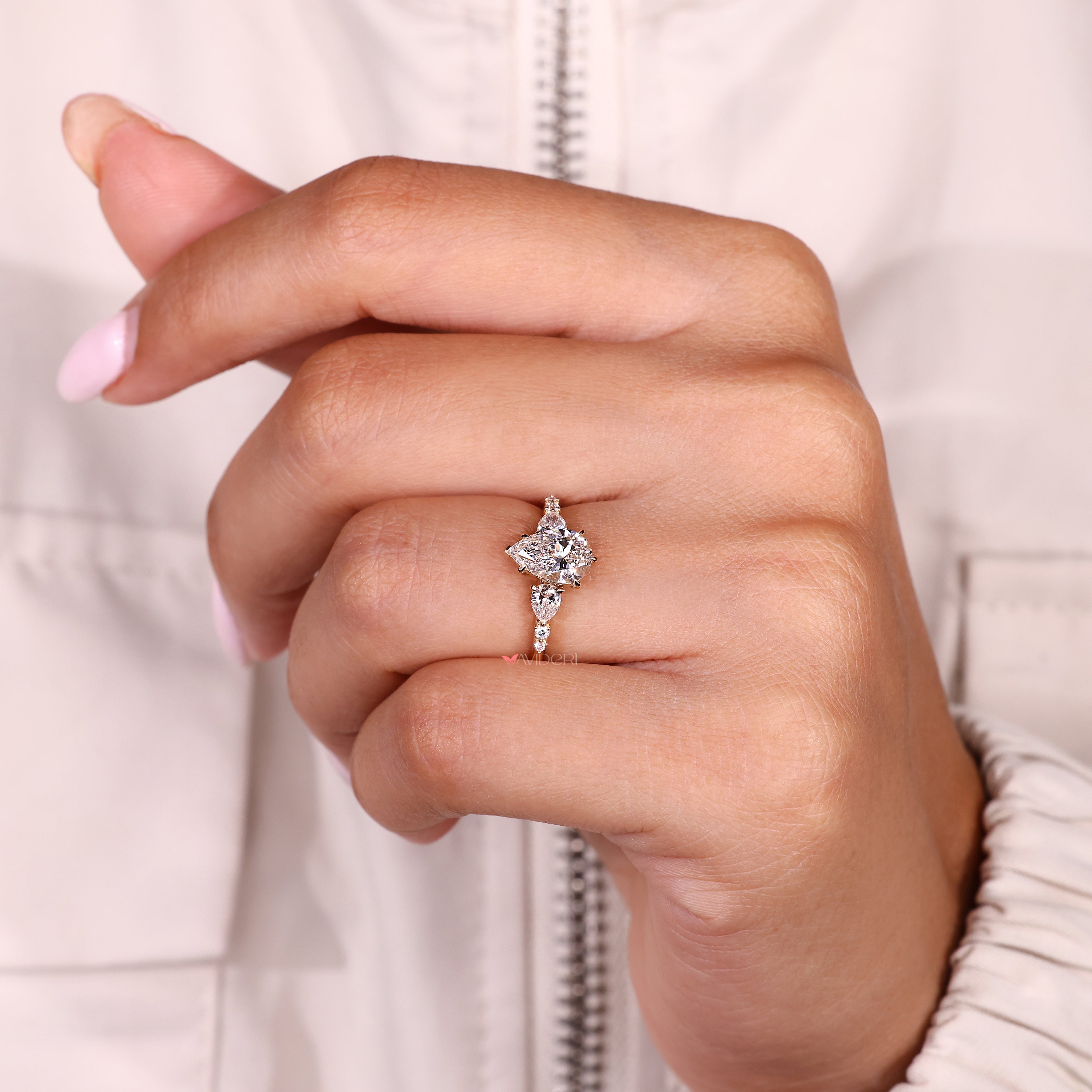 Handmade pear diamond ring with five claw prong setting
