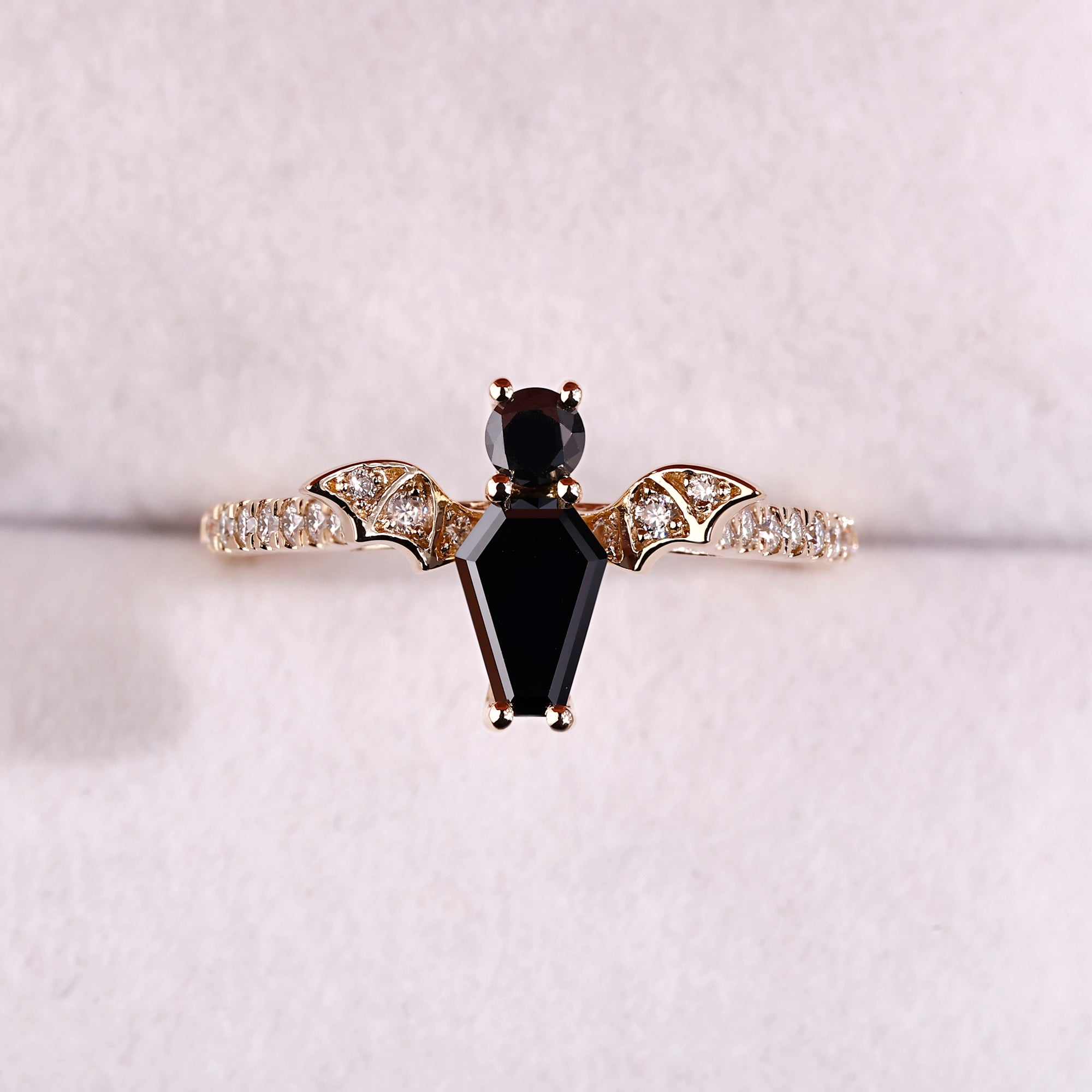 Bat style ring in 4 prong setting style.