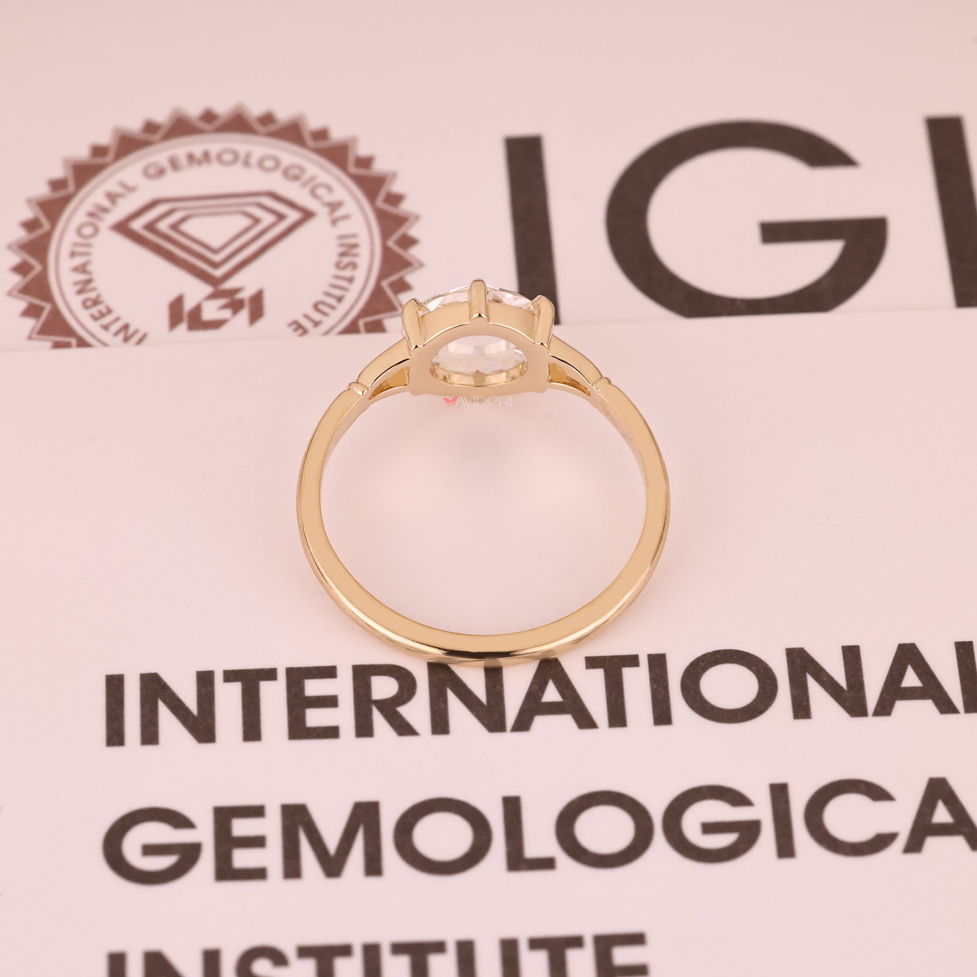 Yellow gold diamond ring on lab-grown diamond ring.
