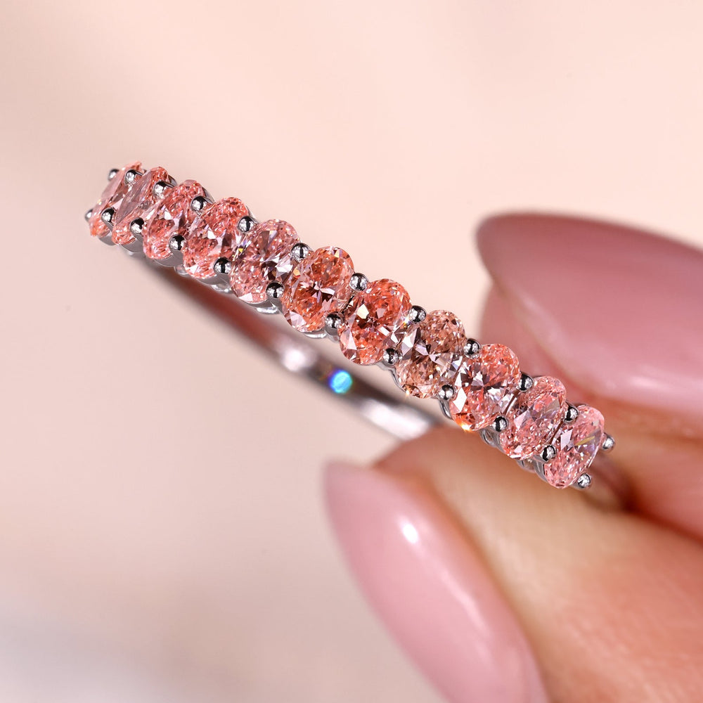 Oval diamond wedding band with shared prong white gold design.