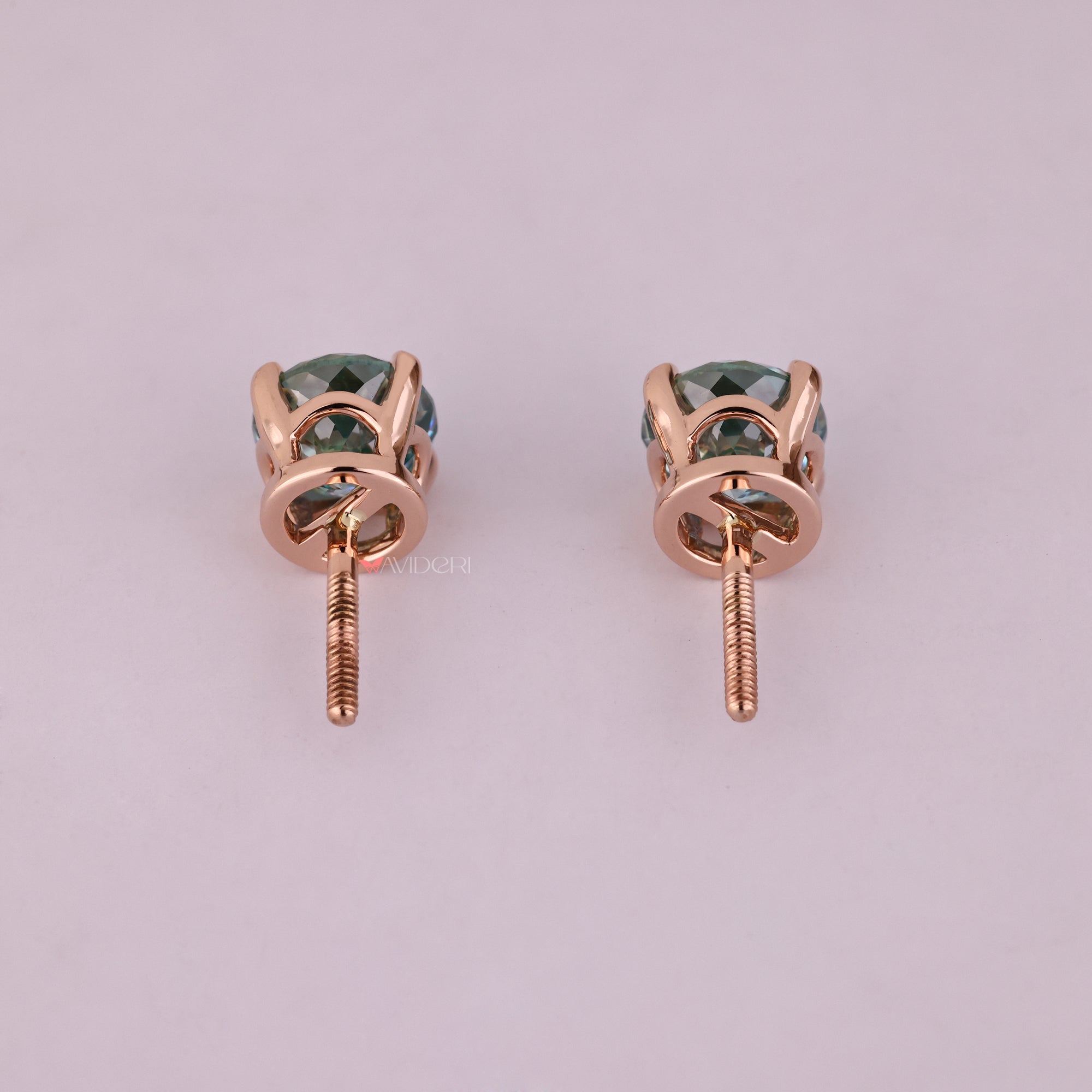 Custom stud earrings with cyan blue earrings detail.