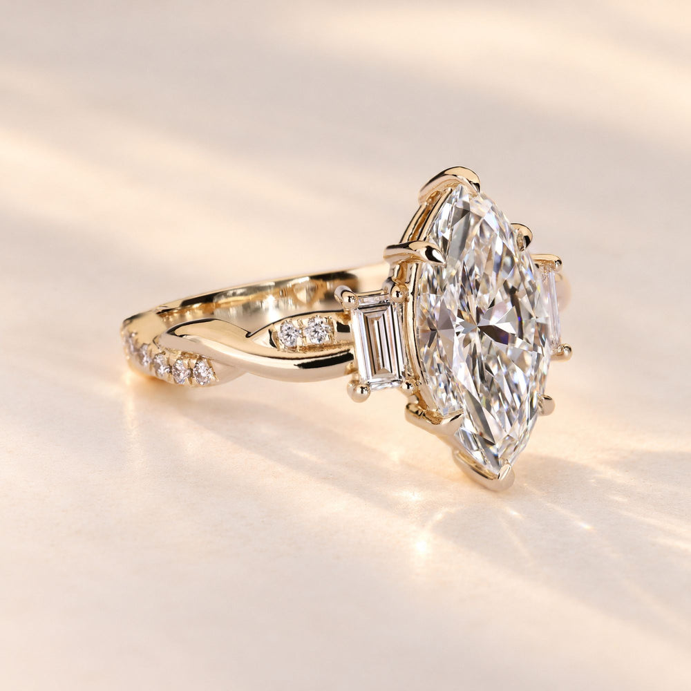 Marquise engagement ring with round diamond pave.

