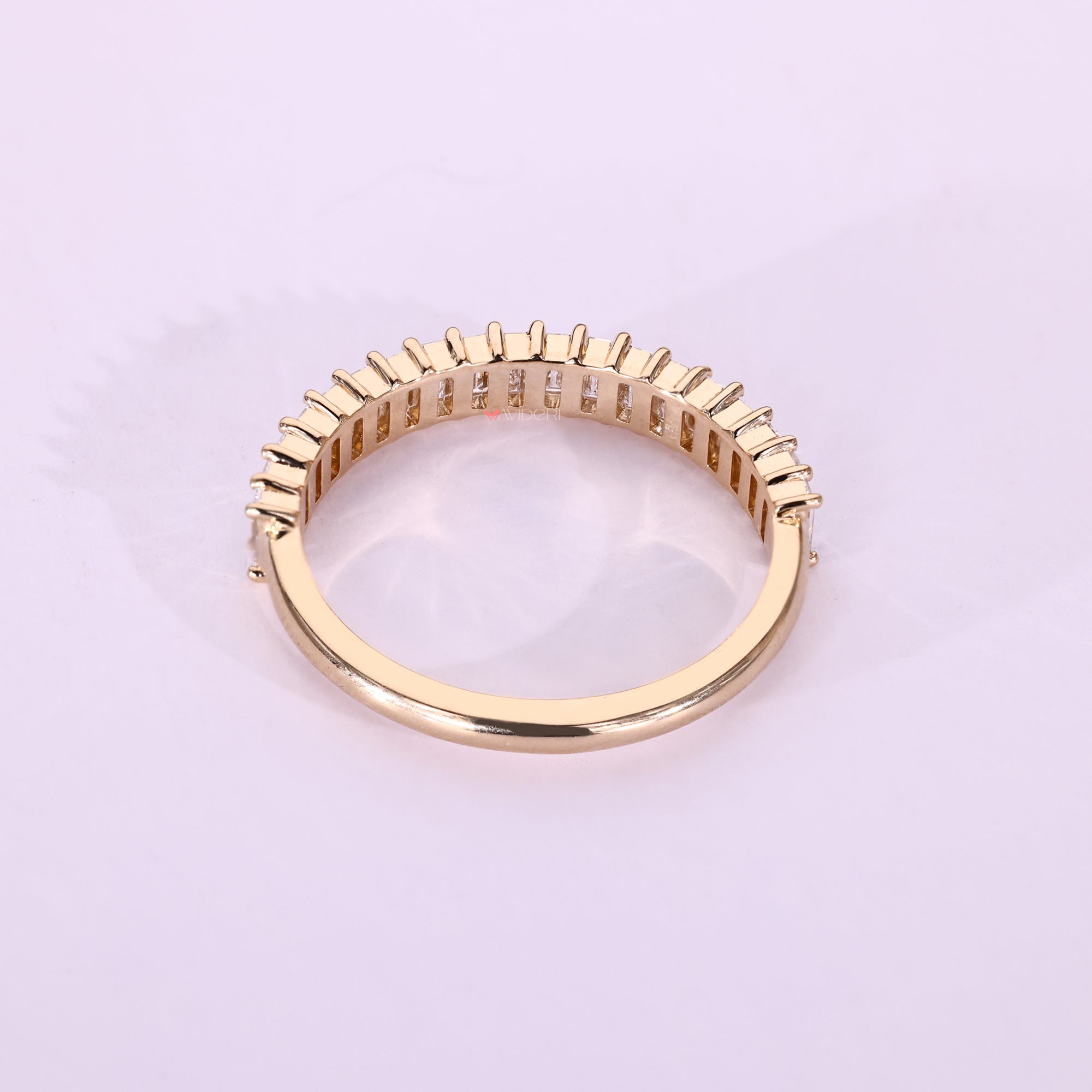 Prong set baguette diamond band handmade.
