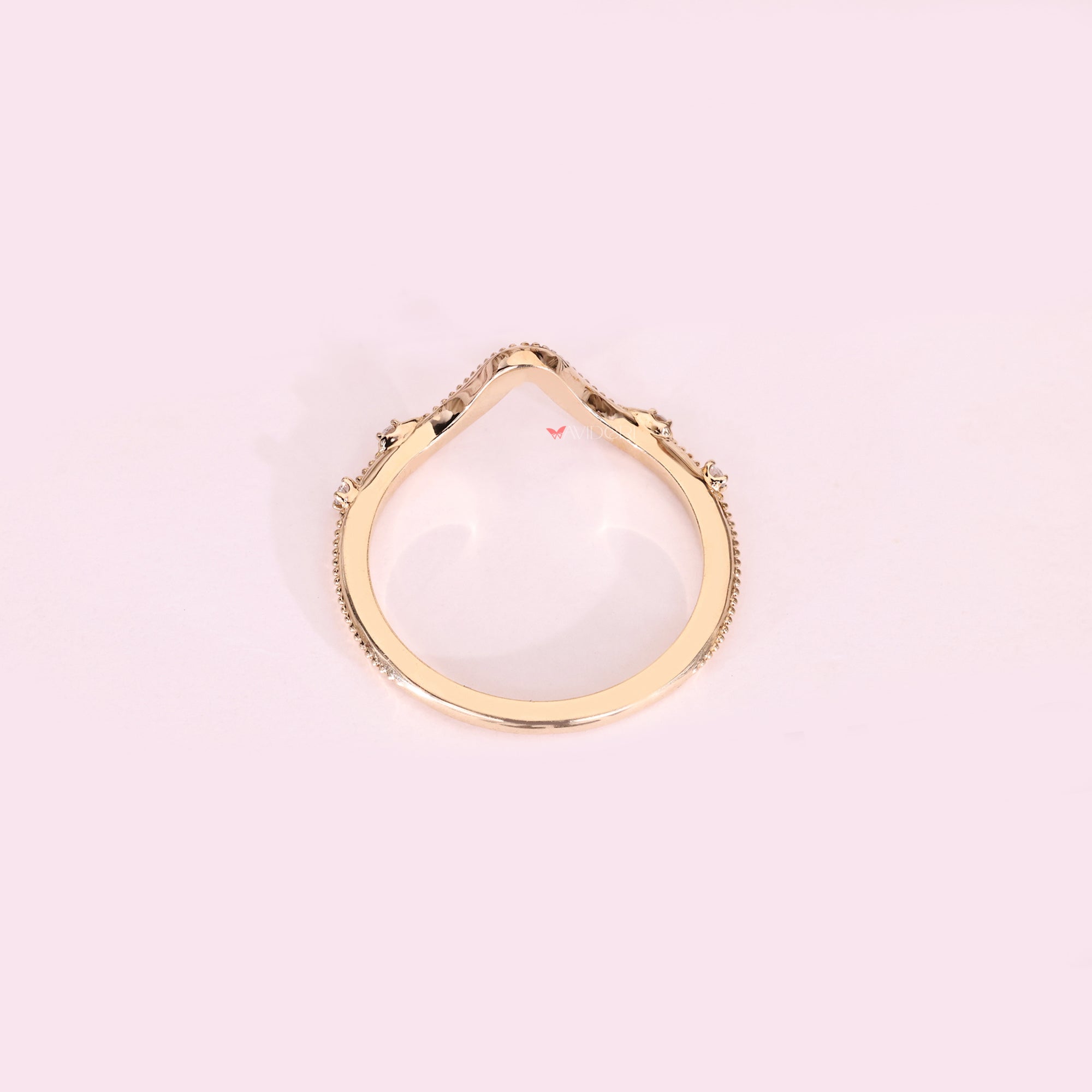 Handmade curved diamond band with four stones.