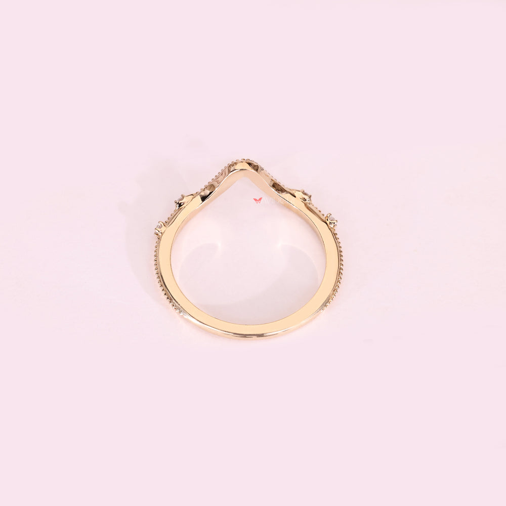 Handmade curved diamond band with four stones.