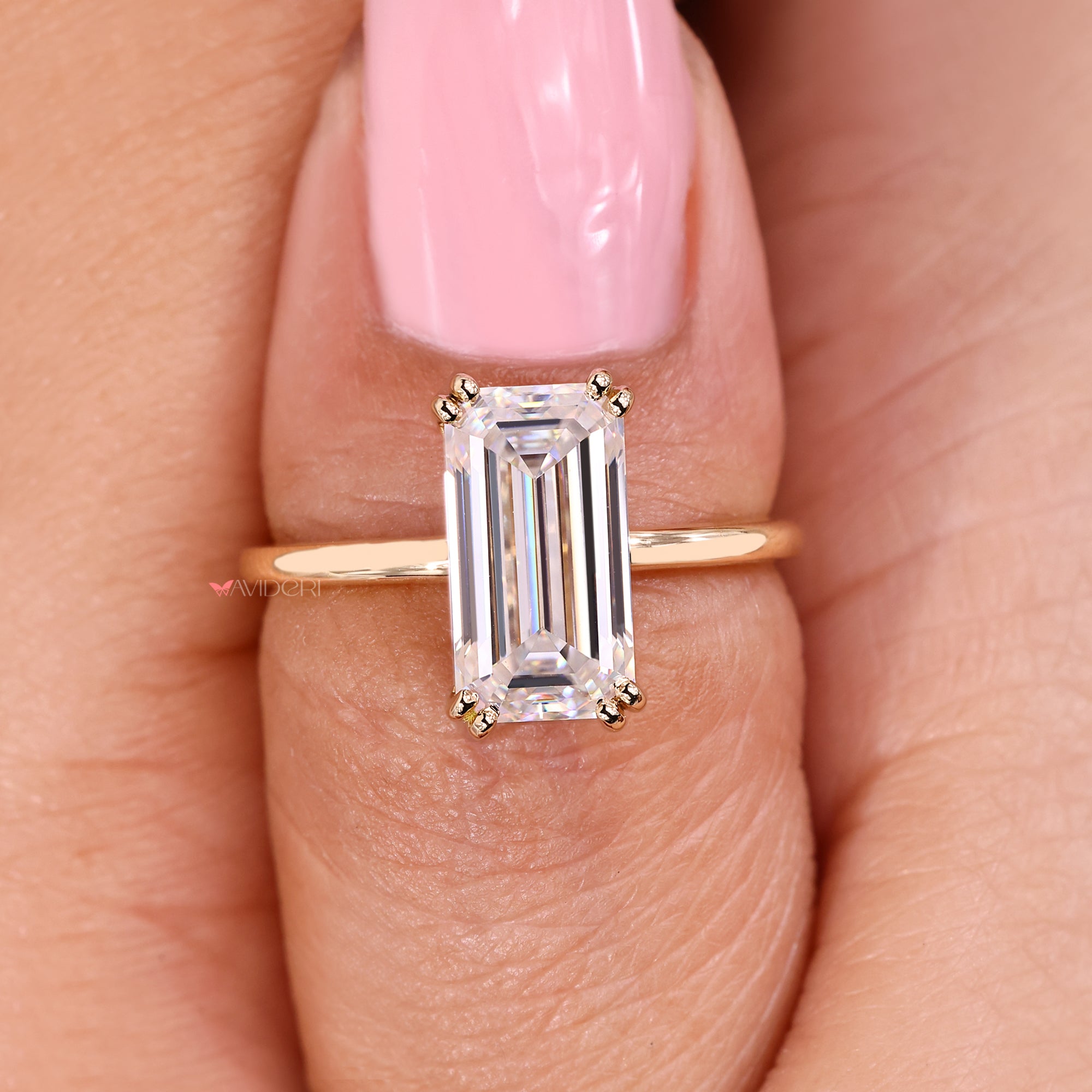 Classic emerald cut solitaire moissanite ring.
