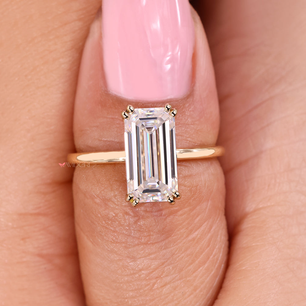 Classic emerald cut solitaire moissanite ring.
