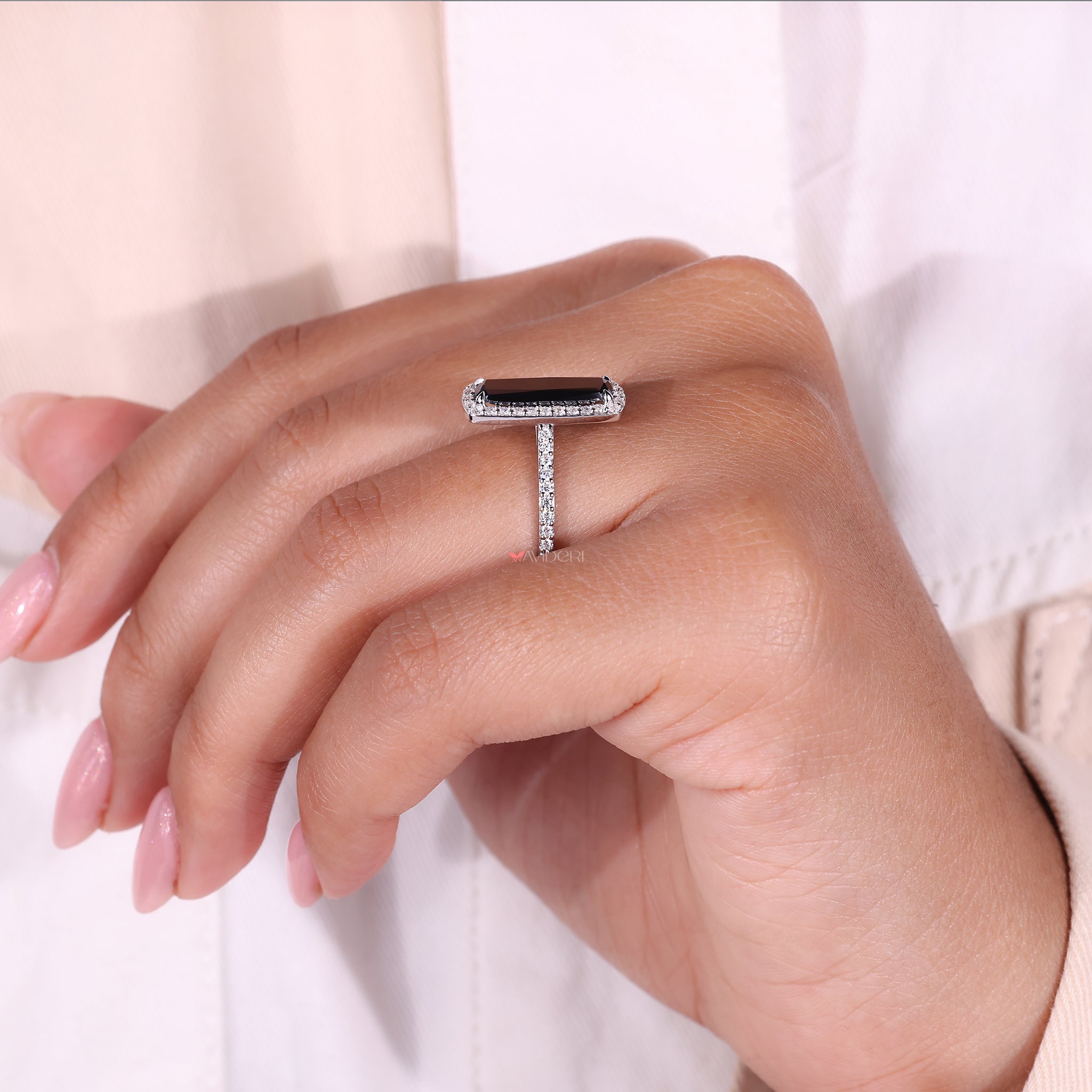 Halo setting ring with round cut pave stones for a brilliant sparkle.
