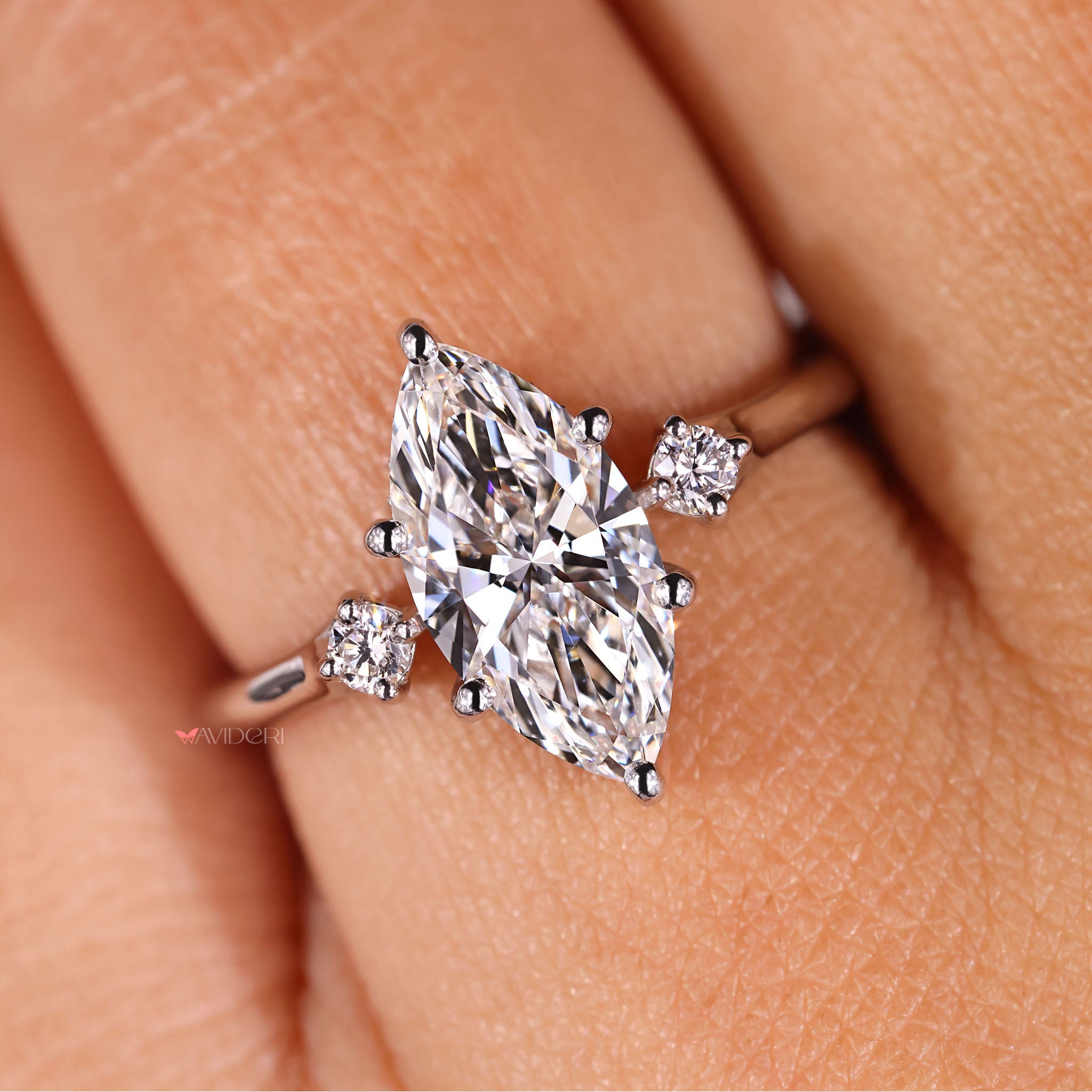 Avideri engagement ring with hidden halo and marquise diamond.