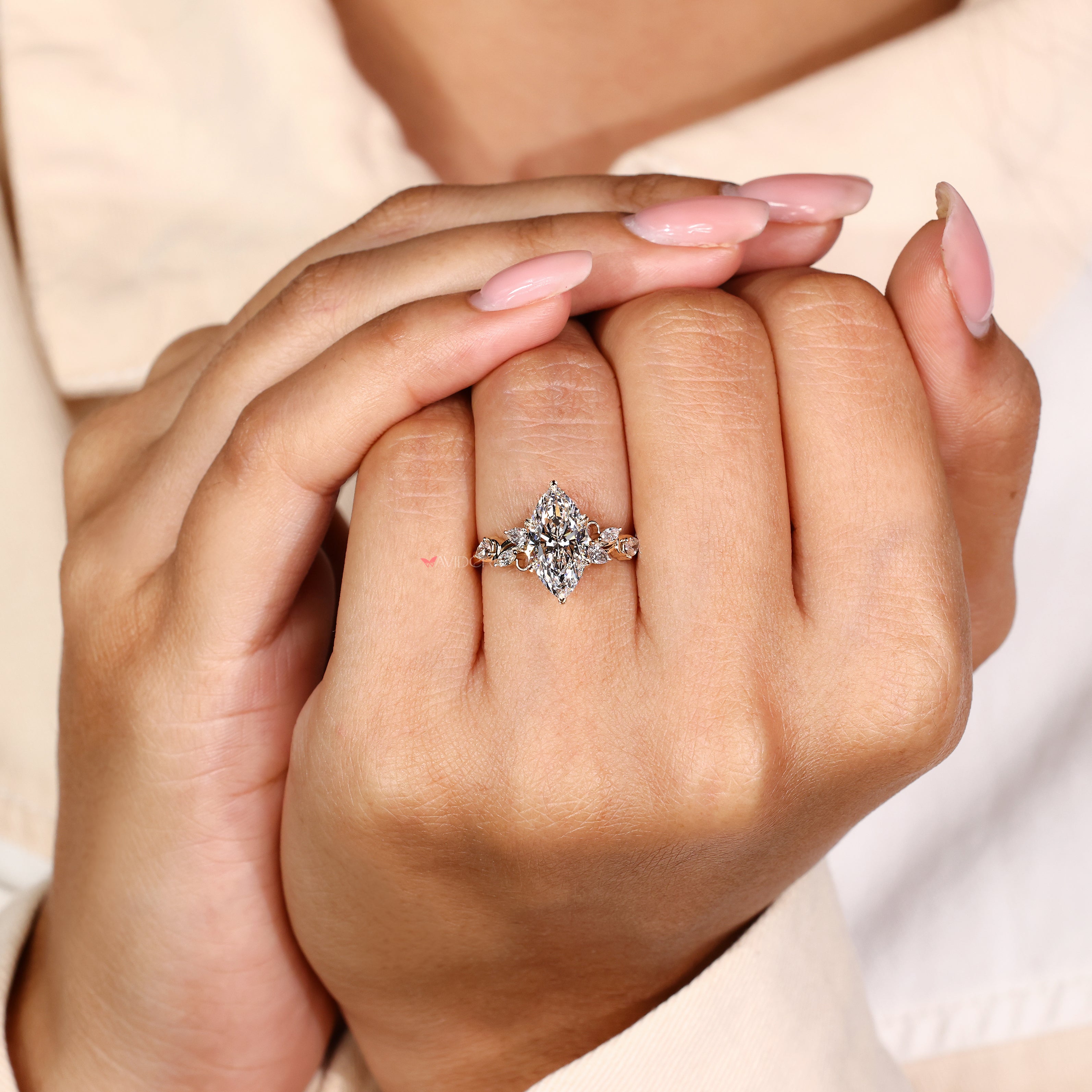 Marquise diamond engagement ring with six leaf style prong setting
