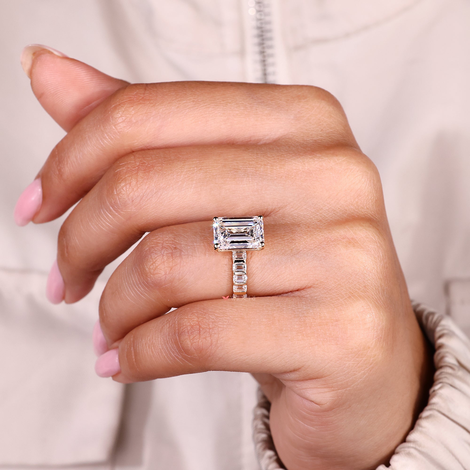 Lab grown emerald cut diamond ring with bar setting.
