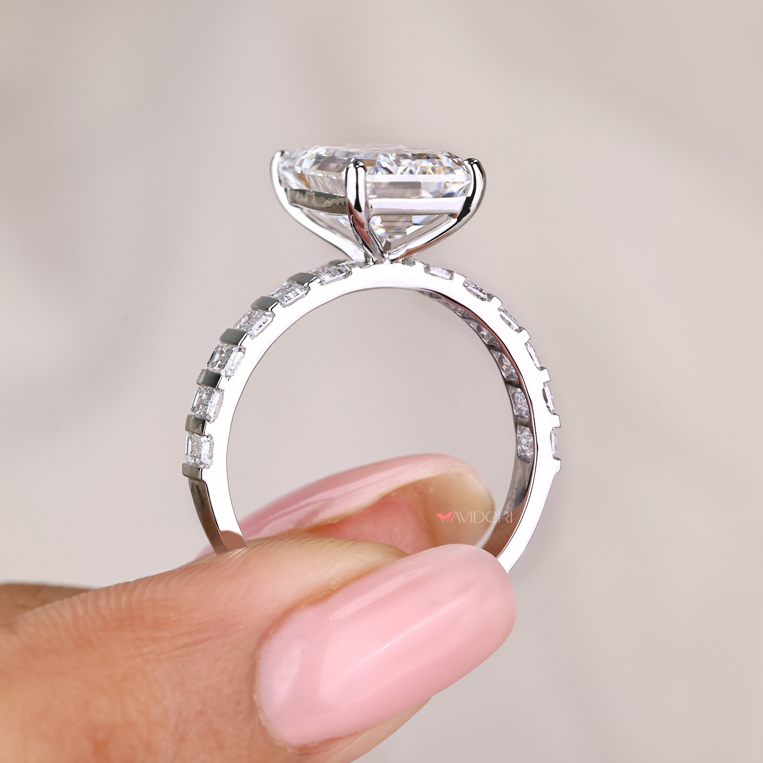 IGI certified emerald diamond ring with four prong setting
