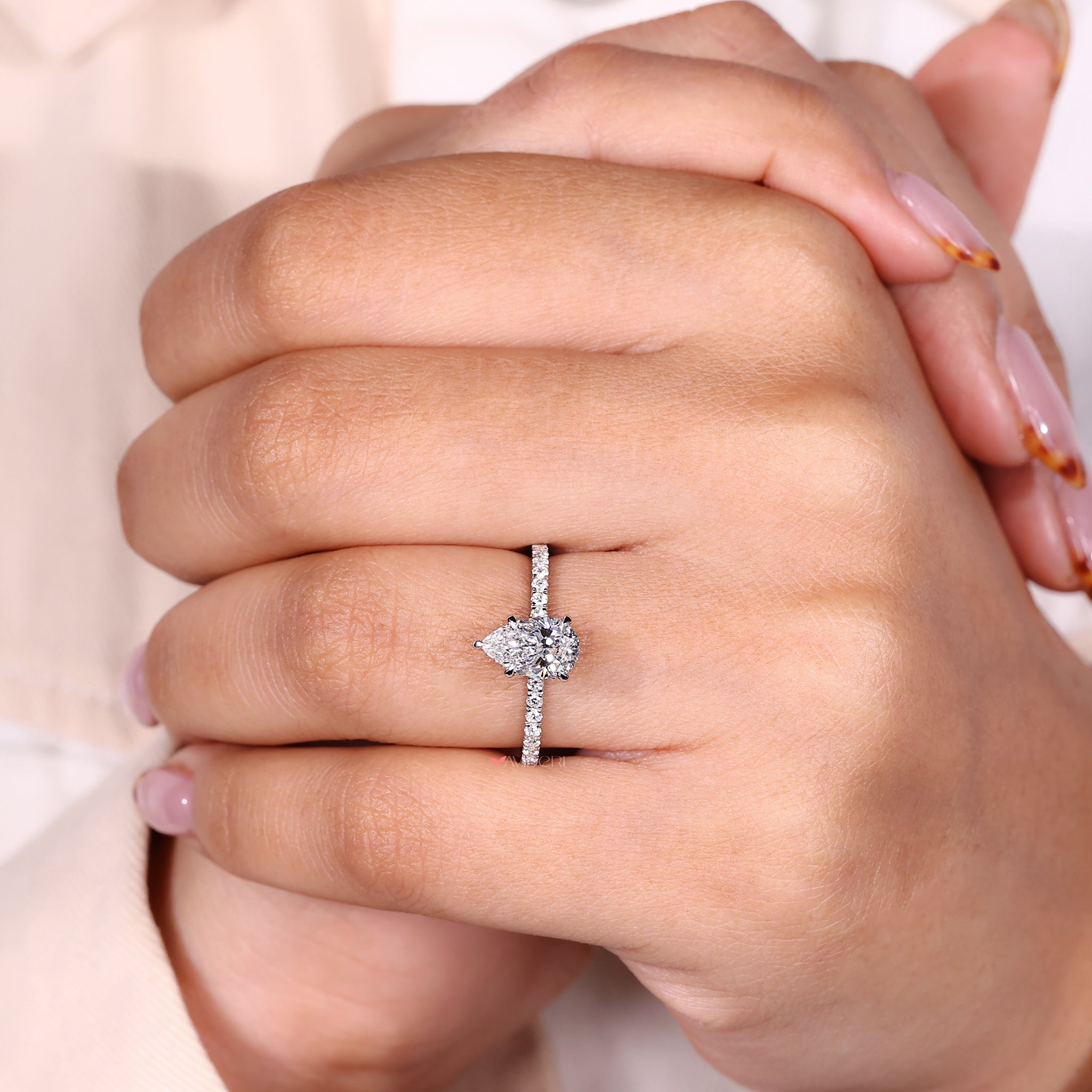 White Gold Ring with a pear-shaped diamond for a sleek engagement look.