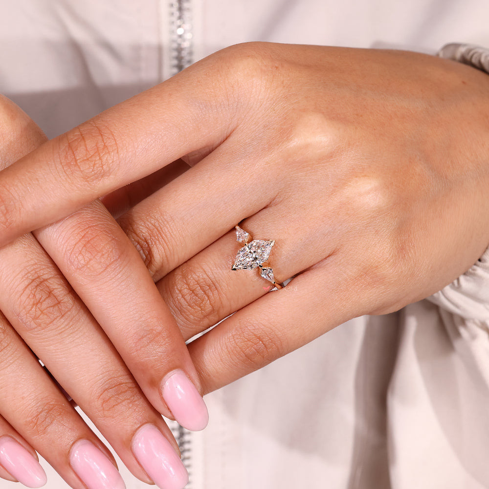 Dutch marquise center diamond ring with tapered shank.
