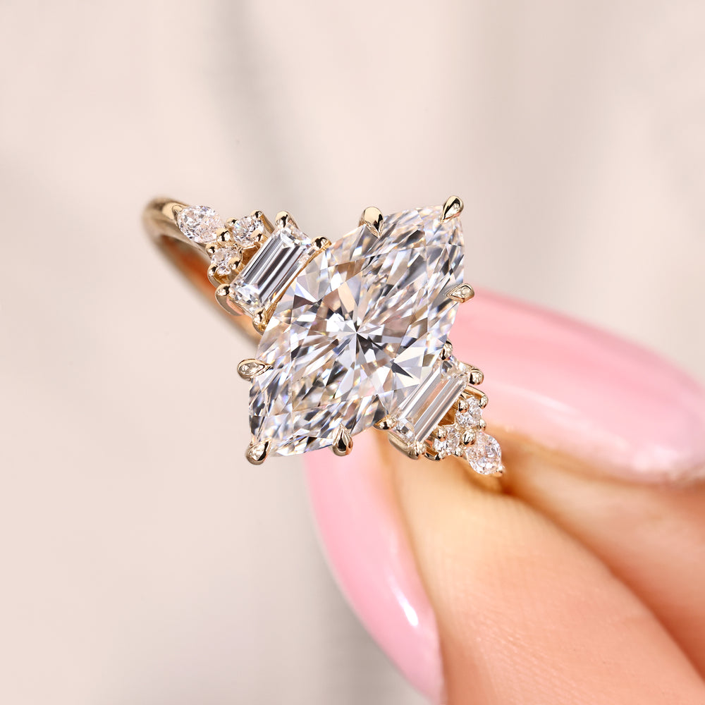 Marquise diamond ring with baguette and round accents.
