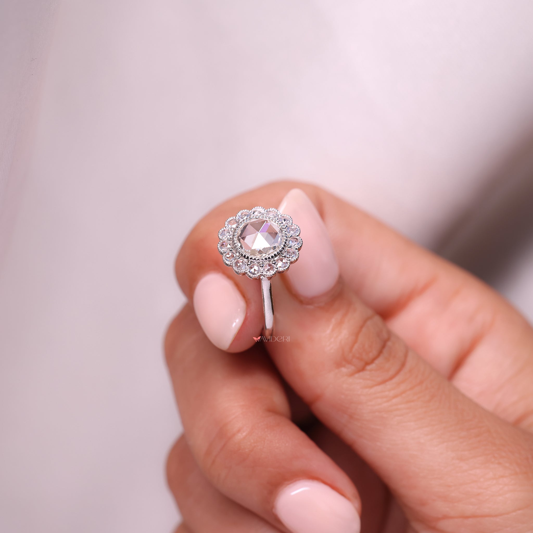 Solitaire Ring with a round rose cut diamond for a distinctive and eye-catching design.