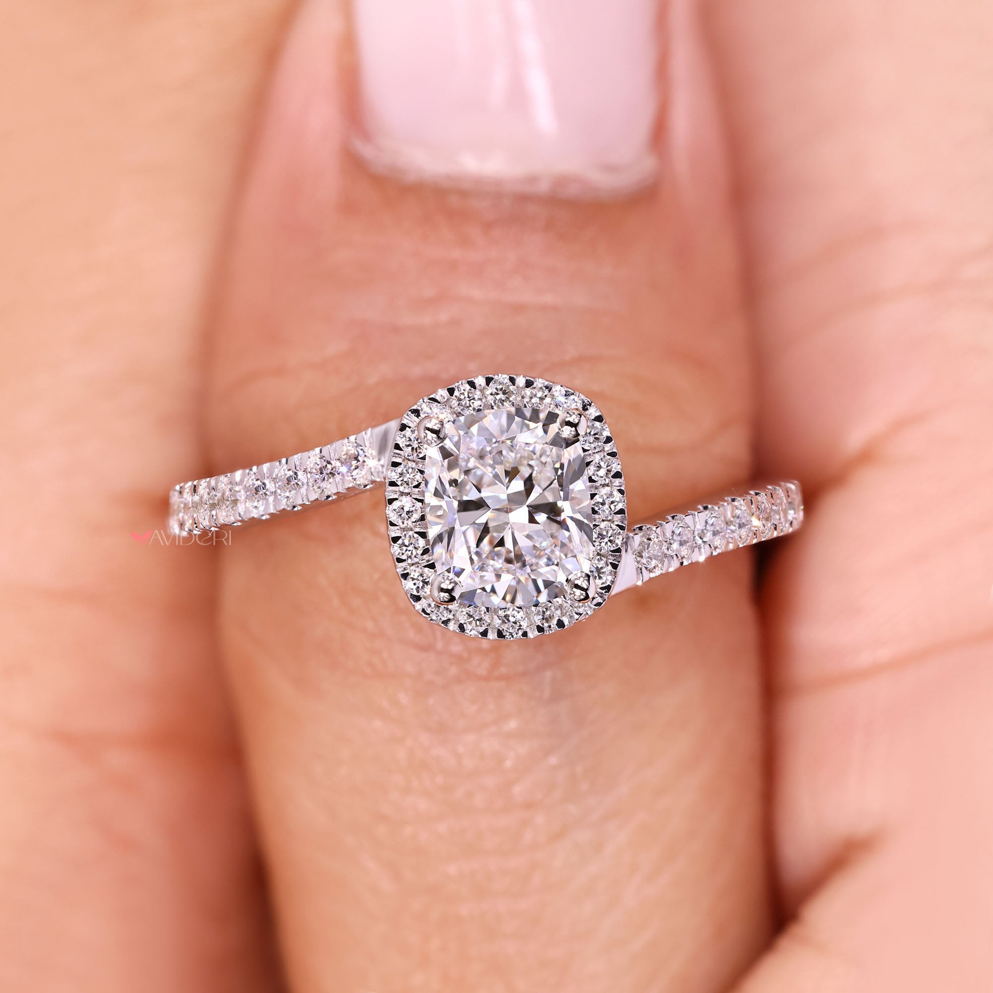Avideri cushion cut diamond ring with halo design.
