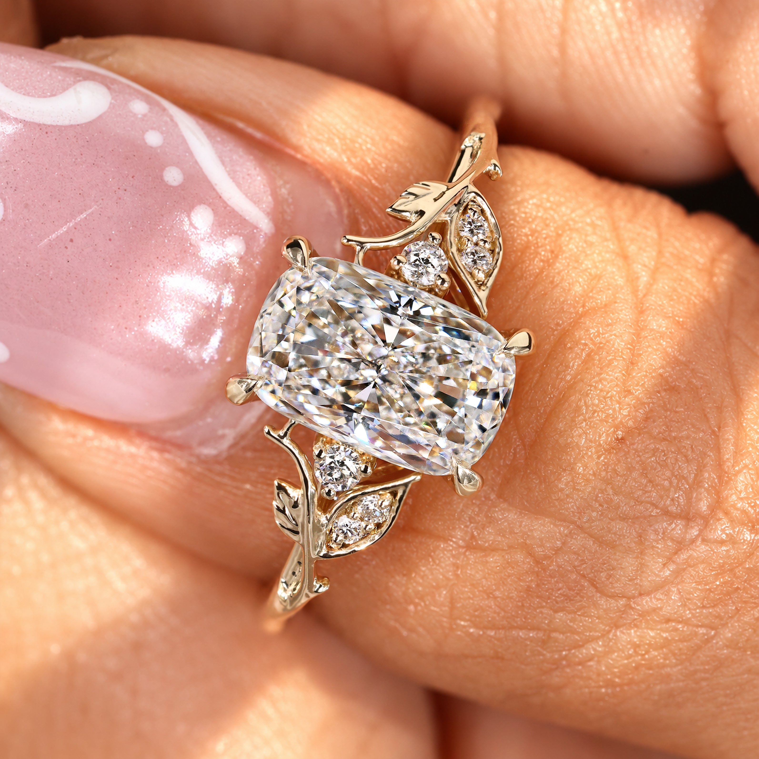 Nature inspired ring with cushion cut lab diamonds.
