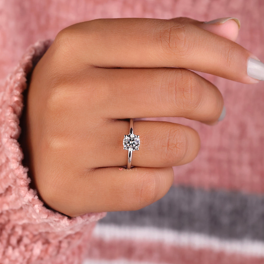 Hidden halo ring featuring a 1 carat solitaire diamond ring for understated glamour.