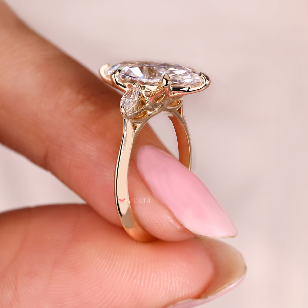 Lab grown three stone diamond ring with knife edge shank.