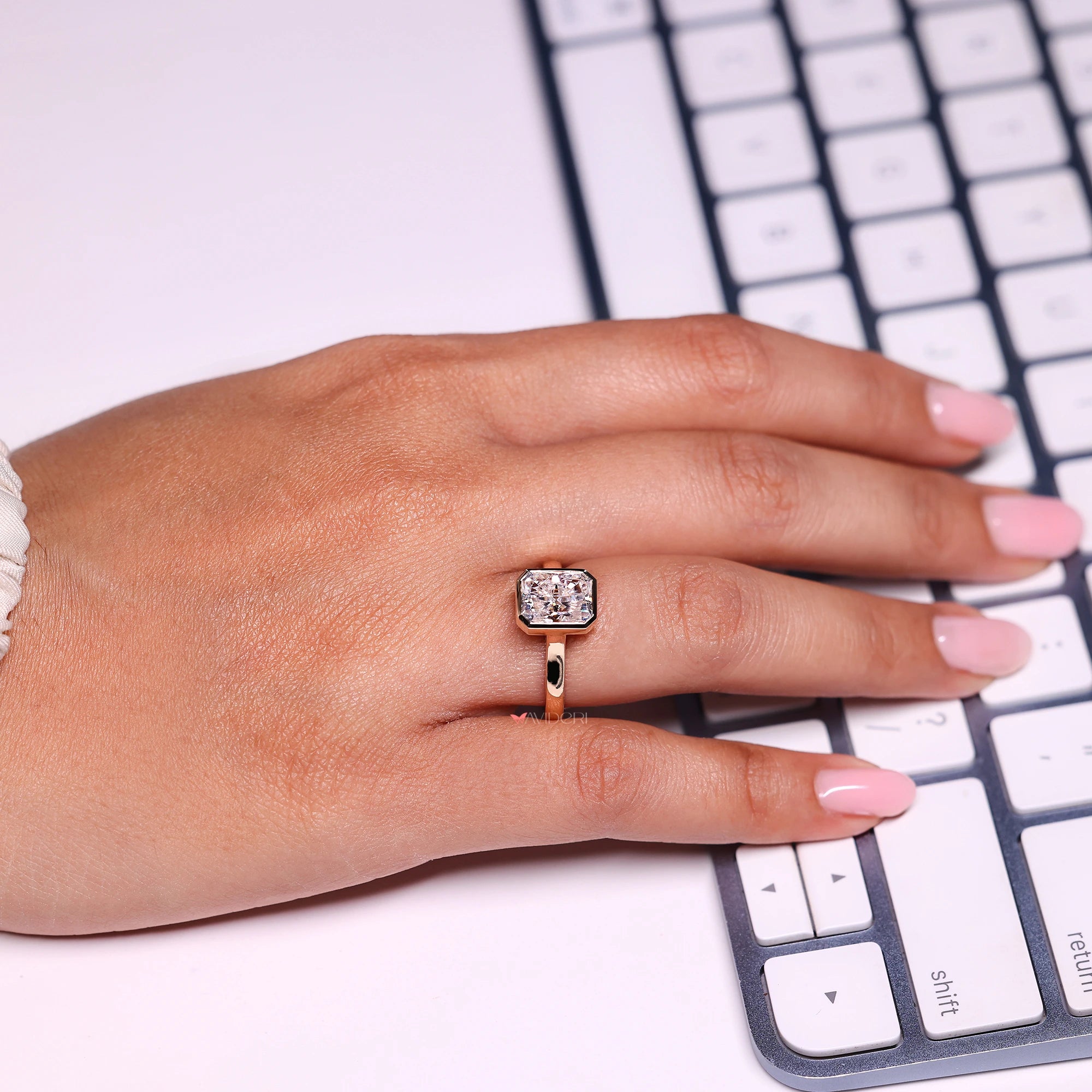 Bezel ring setting holds diamond safely with metal around it.