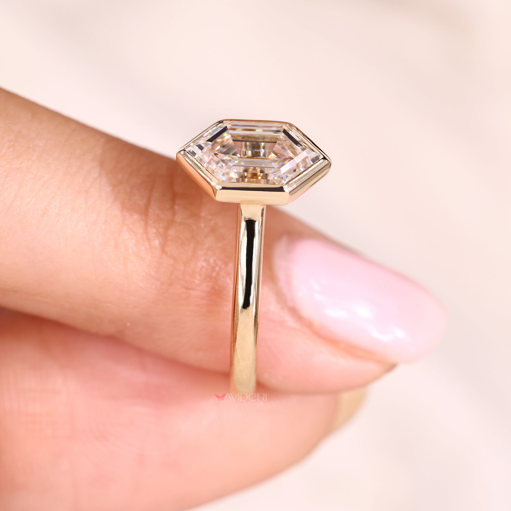 Yellow gold diamond ring with bezel cathedral ring.

