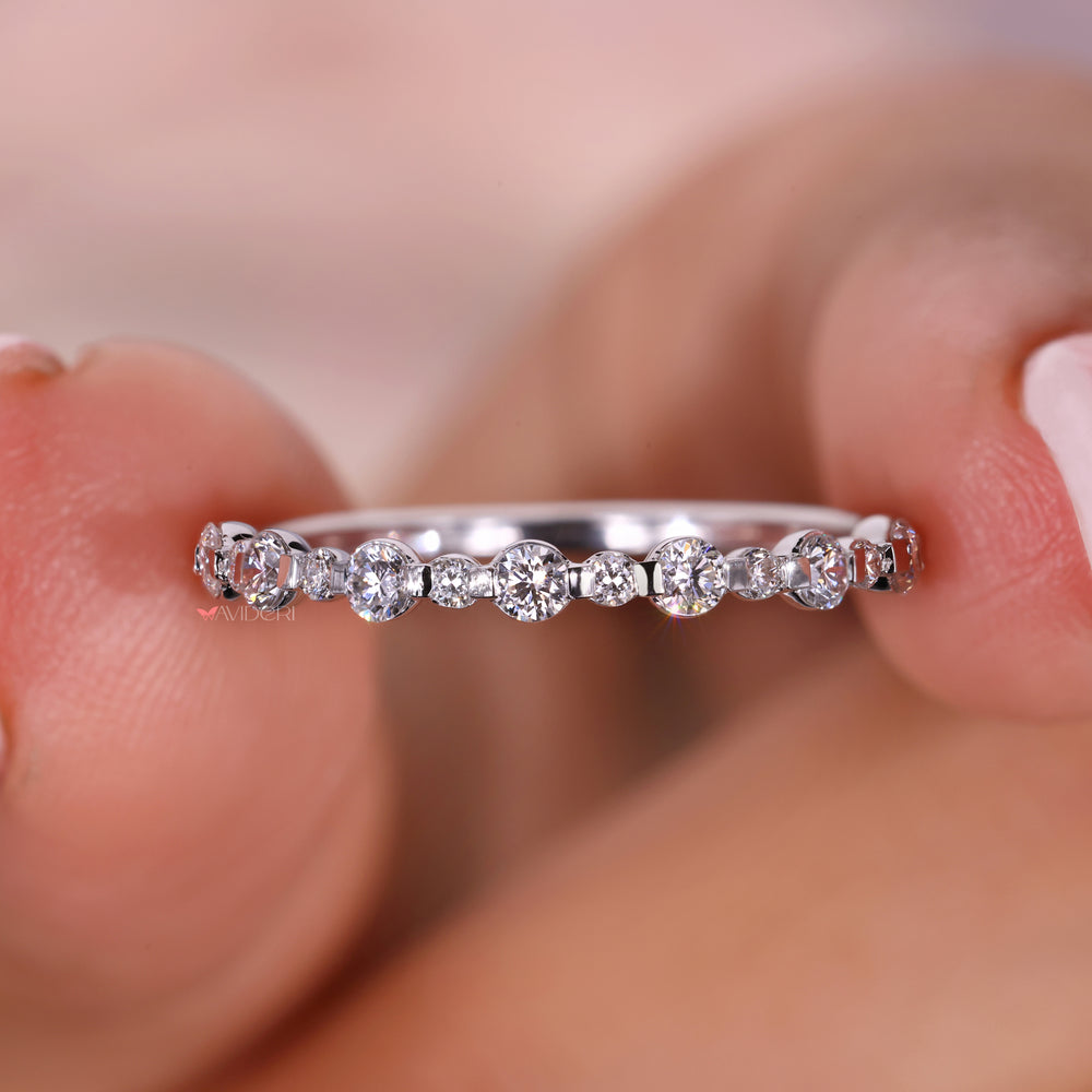 A half eternity wedding band adorned with sparkling diamonds for a subtle yet luxurious look.
