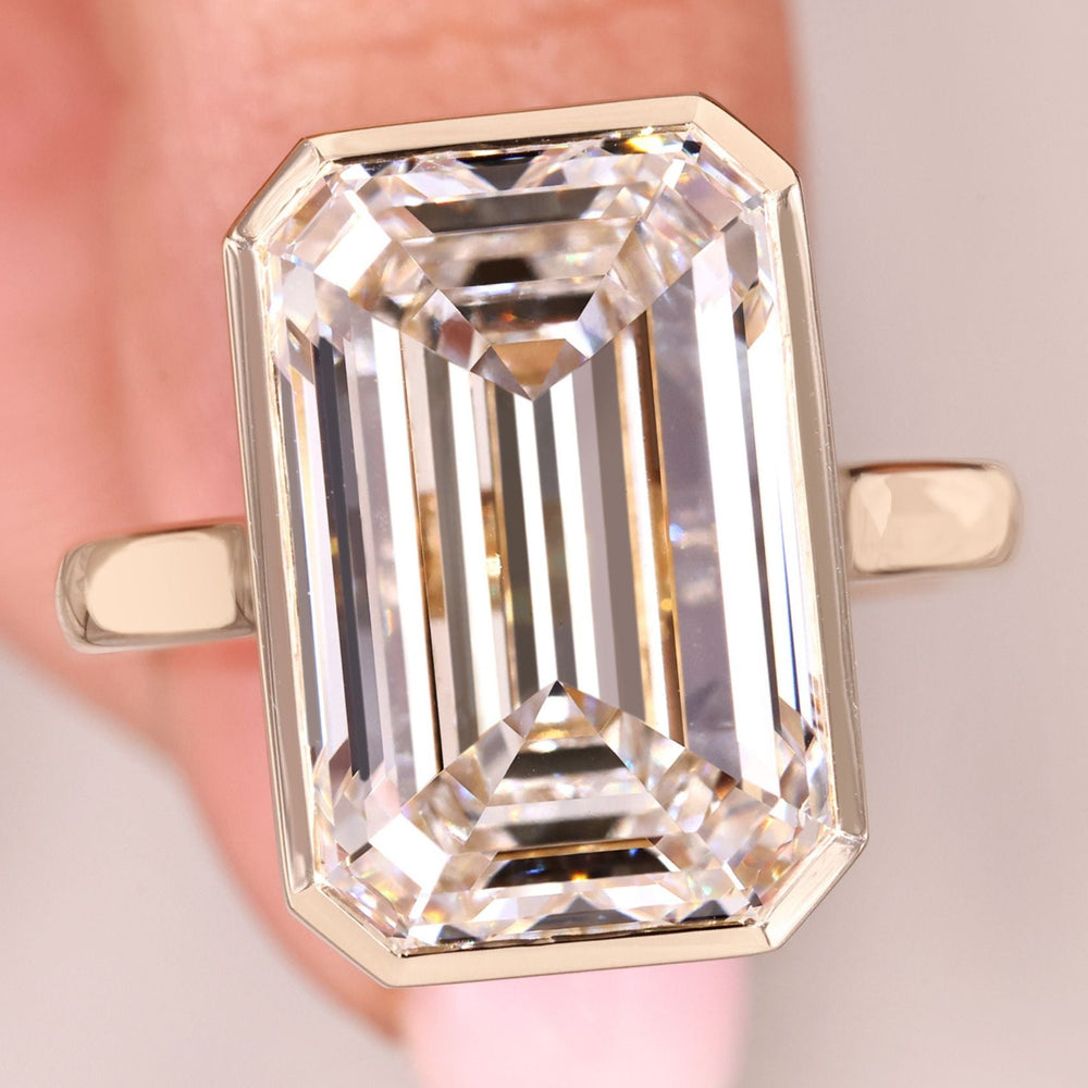 Yellow Gold Emerald Cut Bezel Set Engagement Ring.