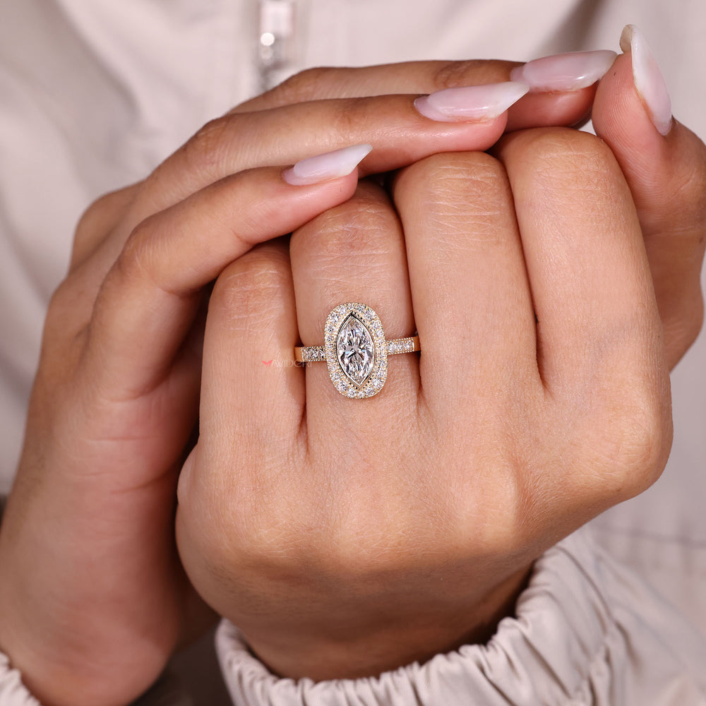 Marquise diamond ring with vintage halo setting.
