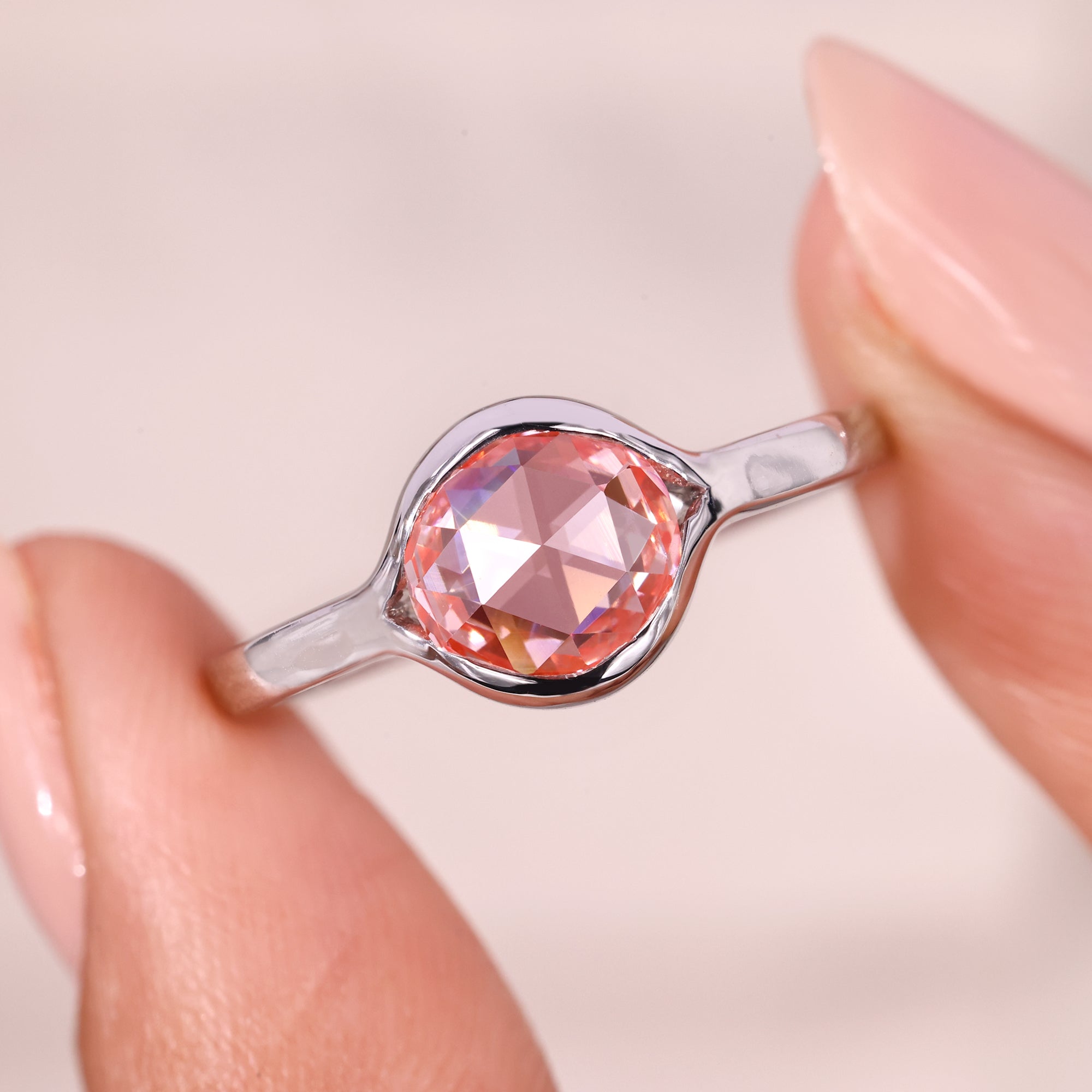 Bezel setting engagement ring with solitaire engagement ring.