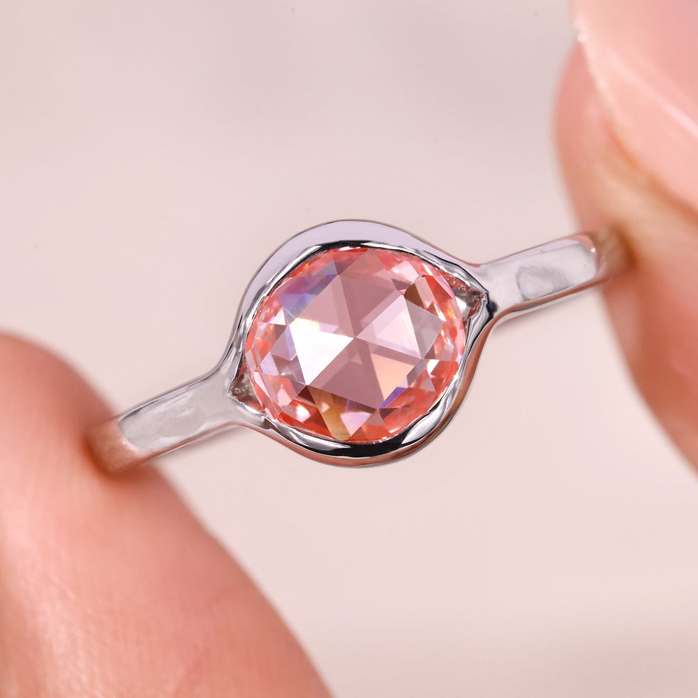Bezel setting engagement ring with solitaire engagement ring.
