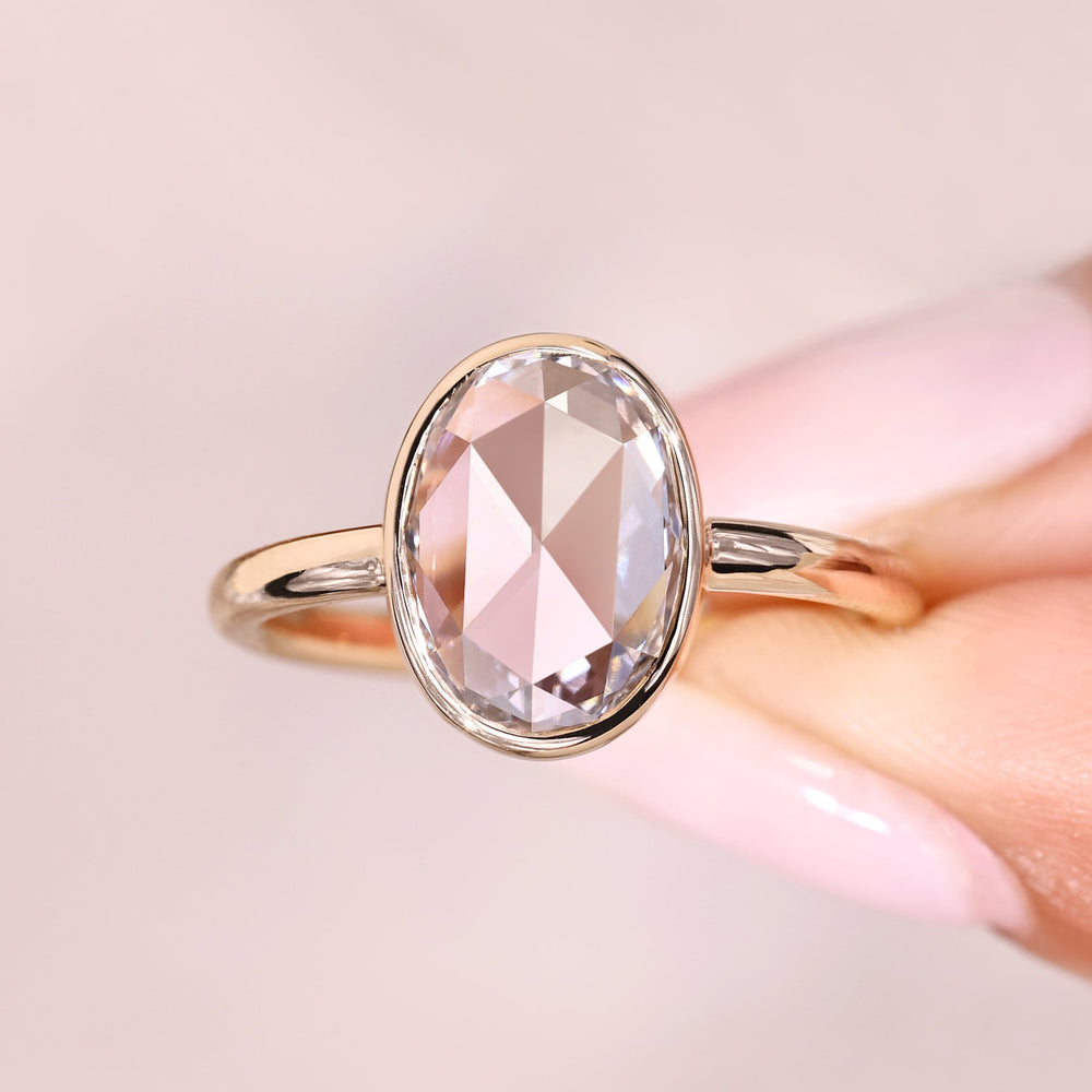 Elegant oval rose cut solitaire diamond ring.
