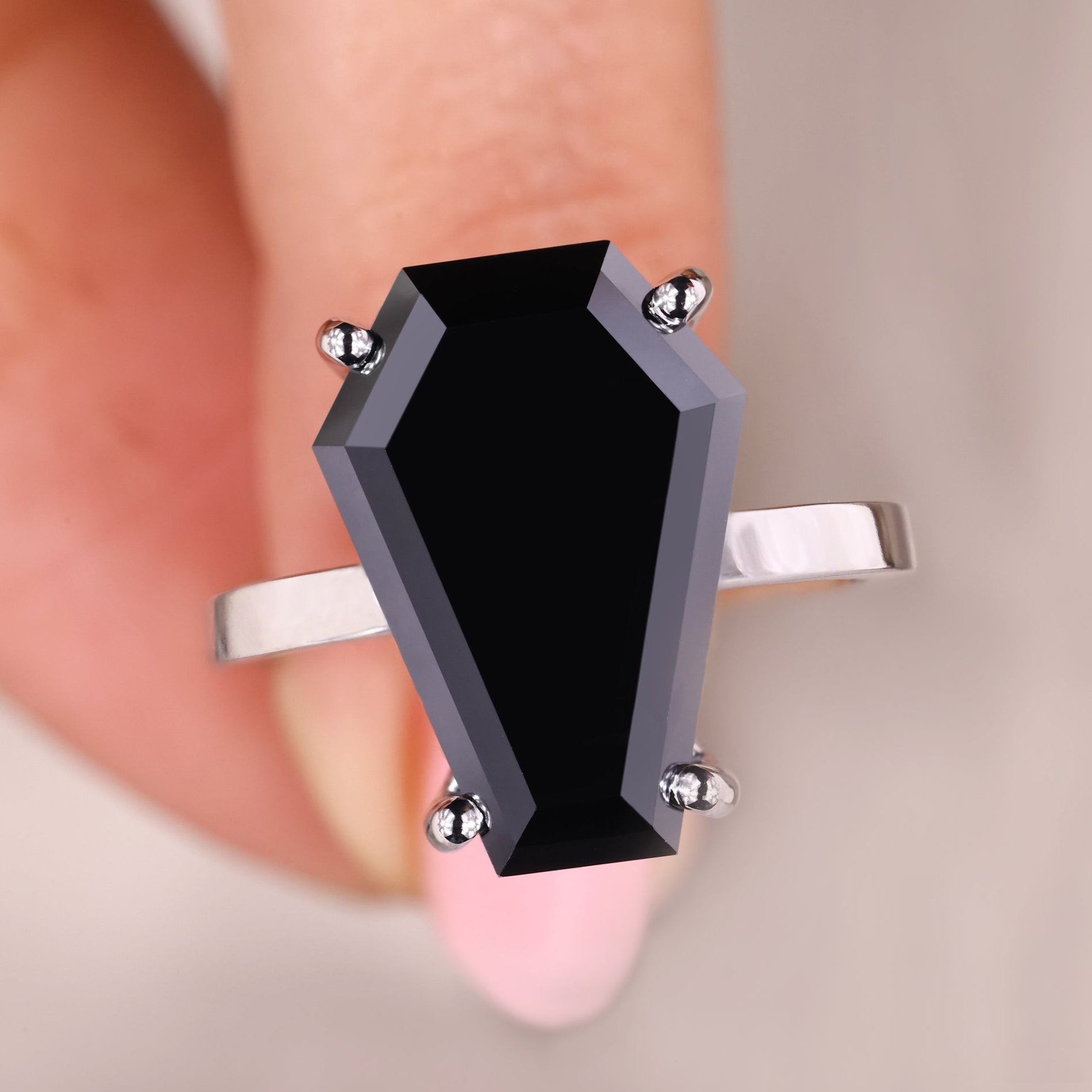 Coffin engagement ring has a strong, bold shape.