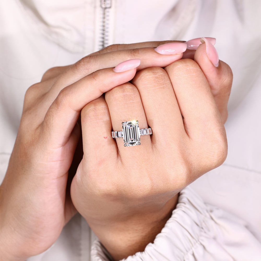 Handmade emerald cut diamond ring with side emerald diamonds
