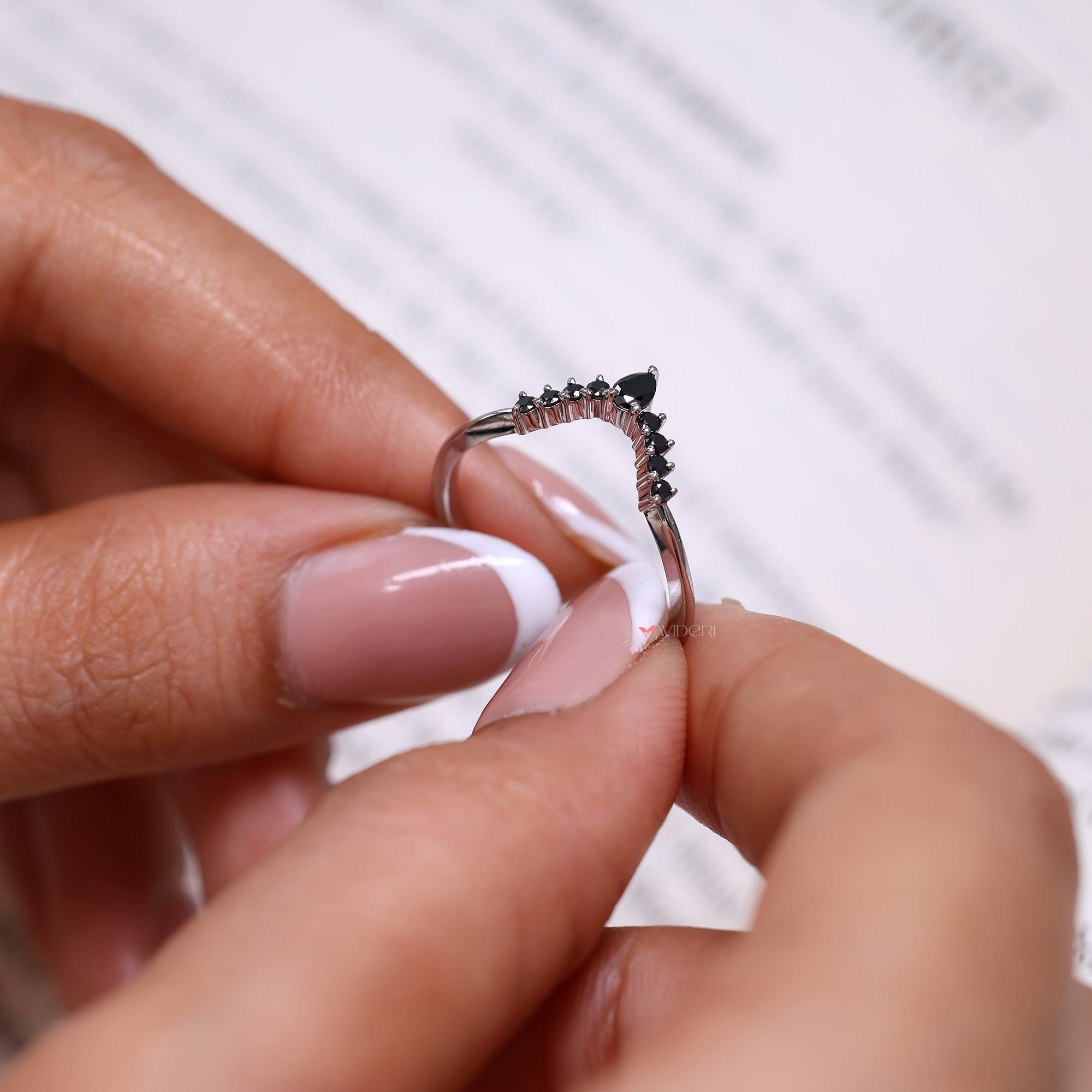 V shaped wedding band with pear cut wedding band.