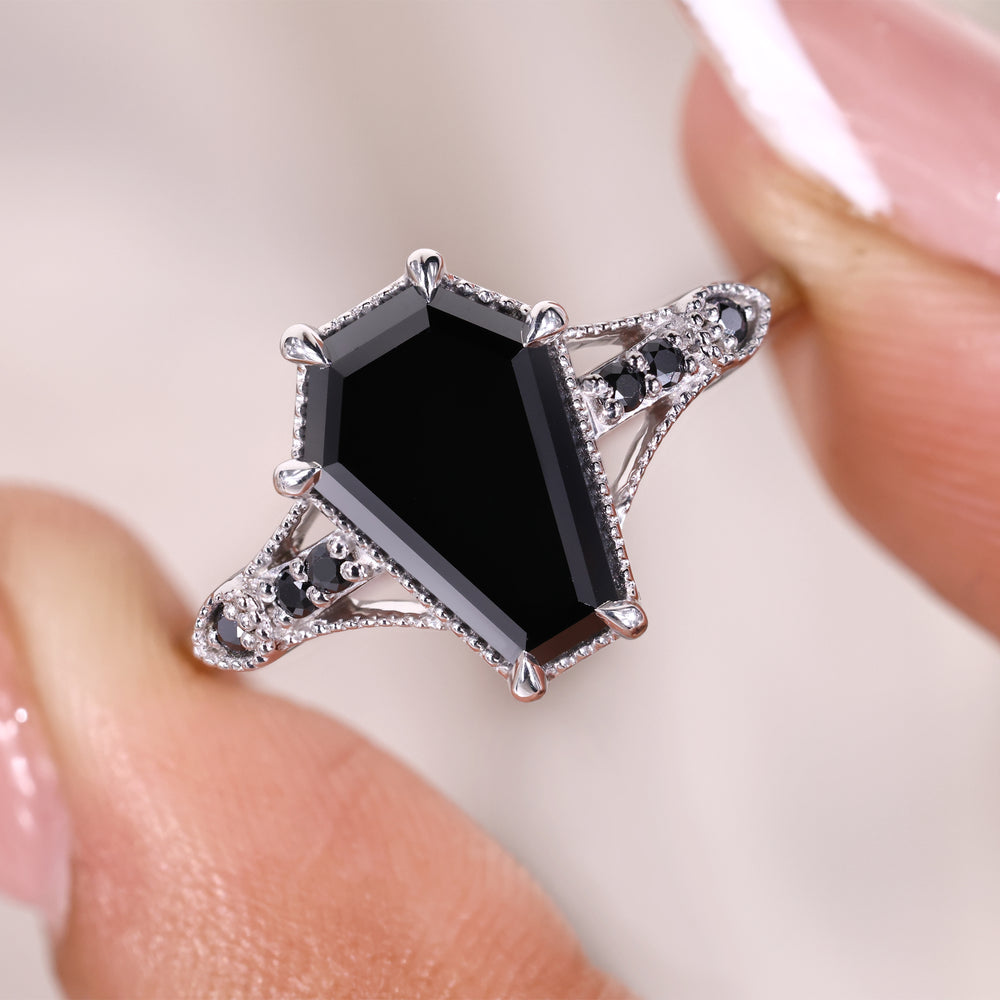 6 claw prong setting on black coffin cut ring.