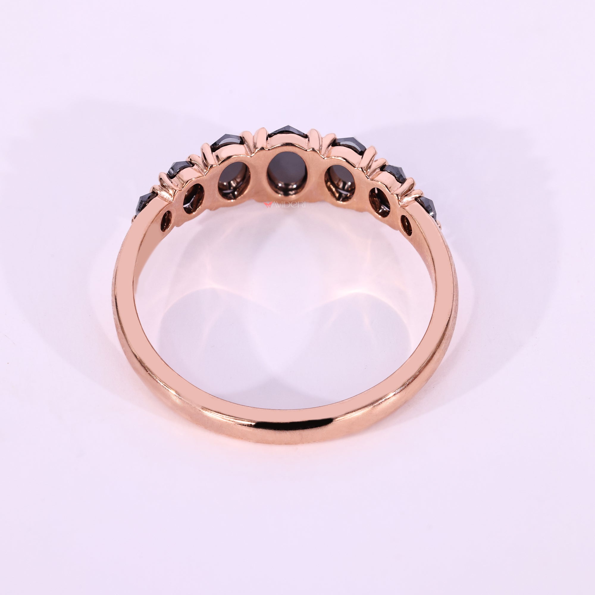 Rose gold wedding band with moissanite wedding band.