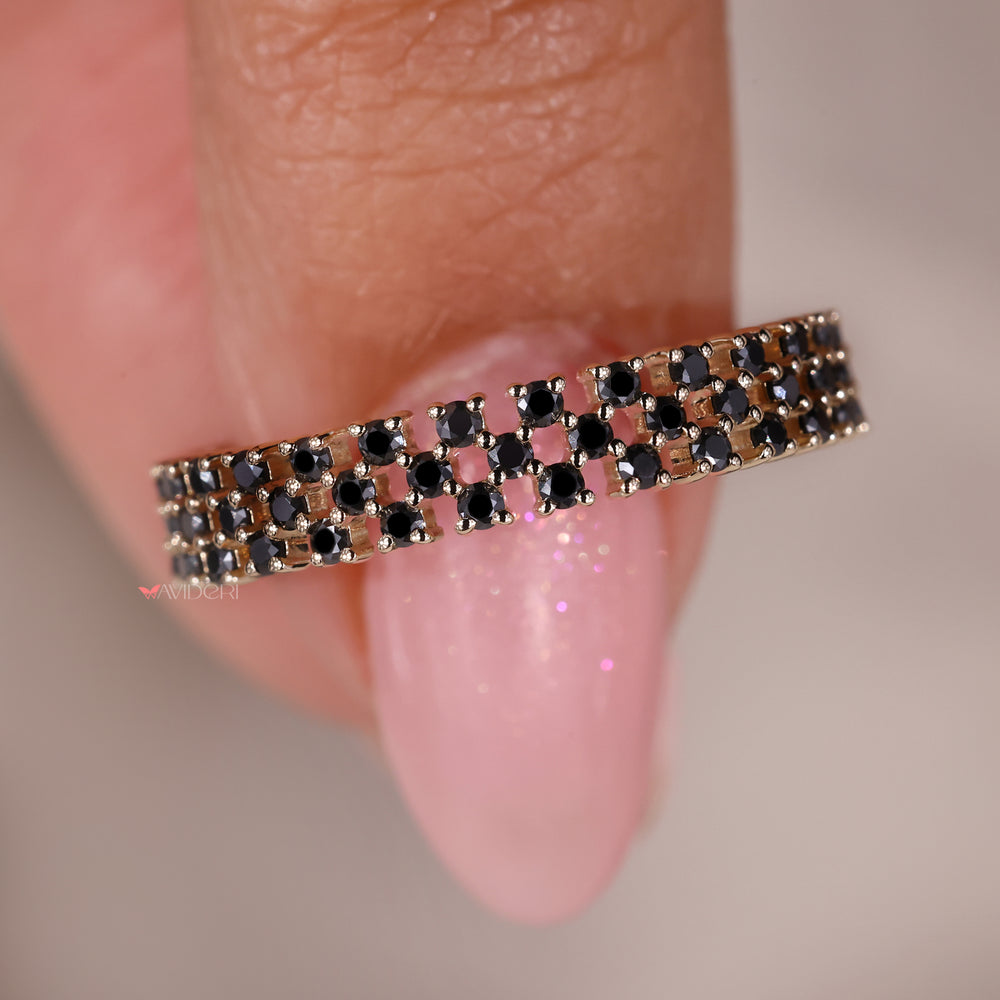 The designer wedding band features a unique, stylish design.