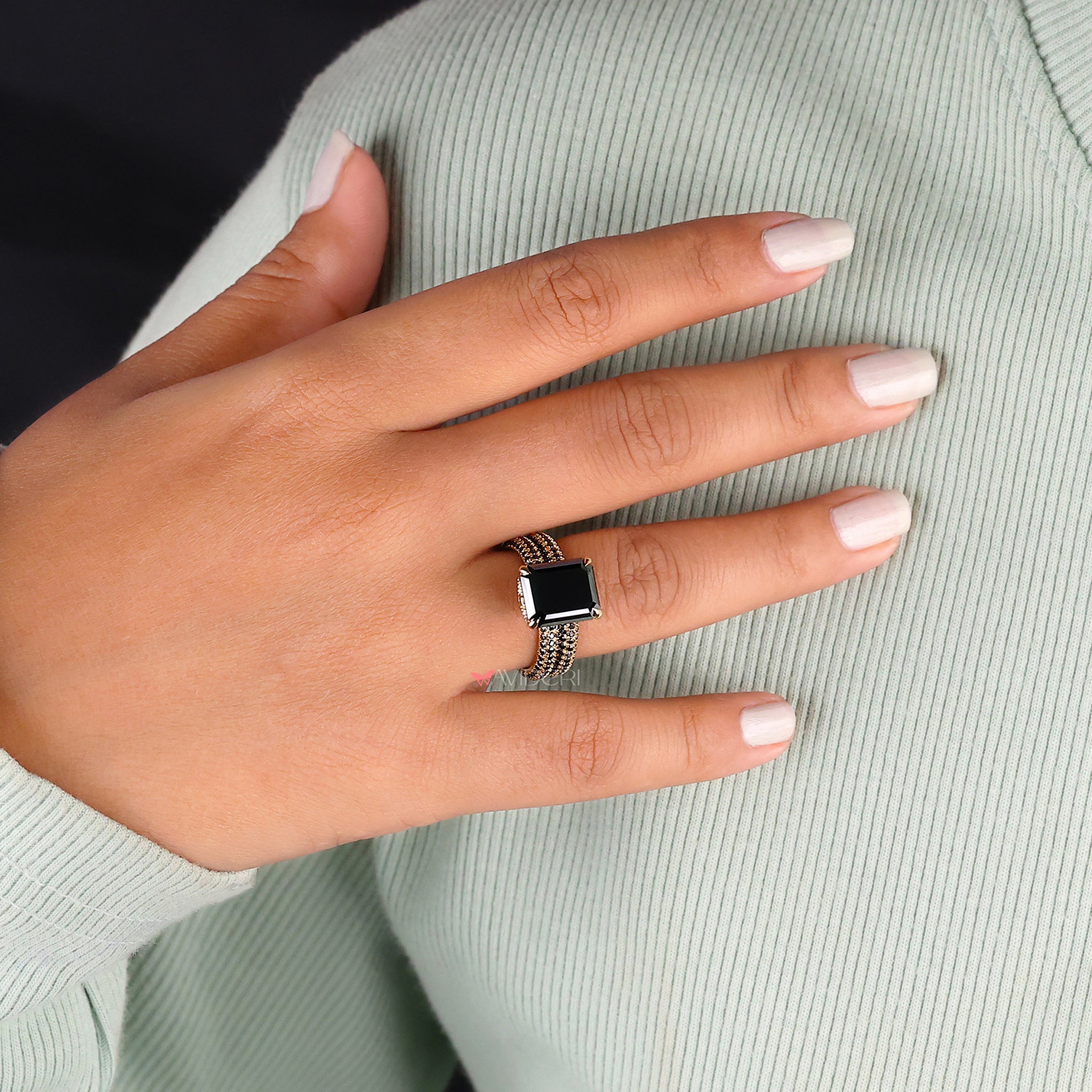 Handmade bridal set featuring an emerald cut moissanite ring for a personalized touch.