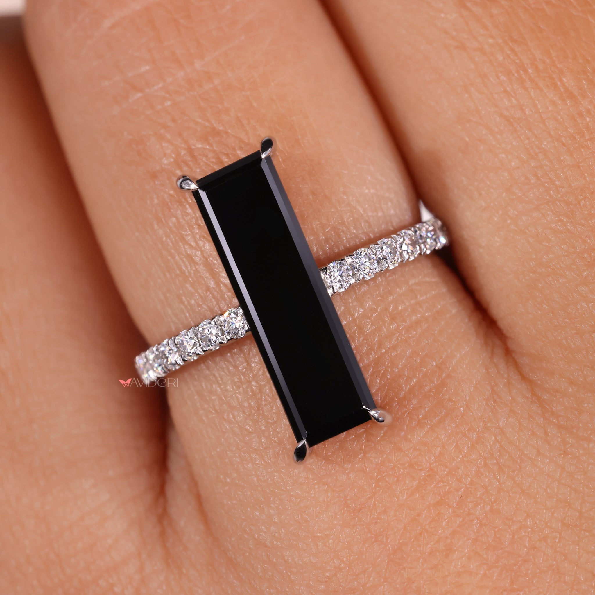 Black moissanite ring with modern minimalist style.