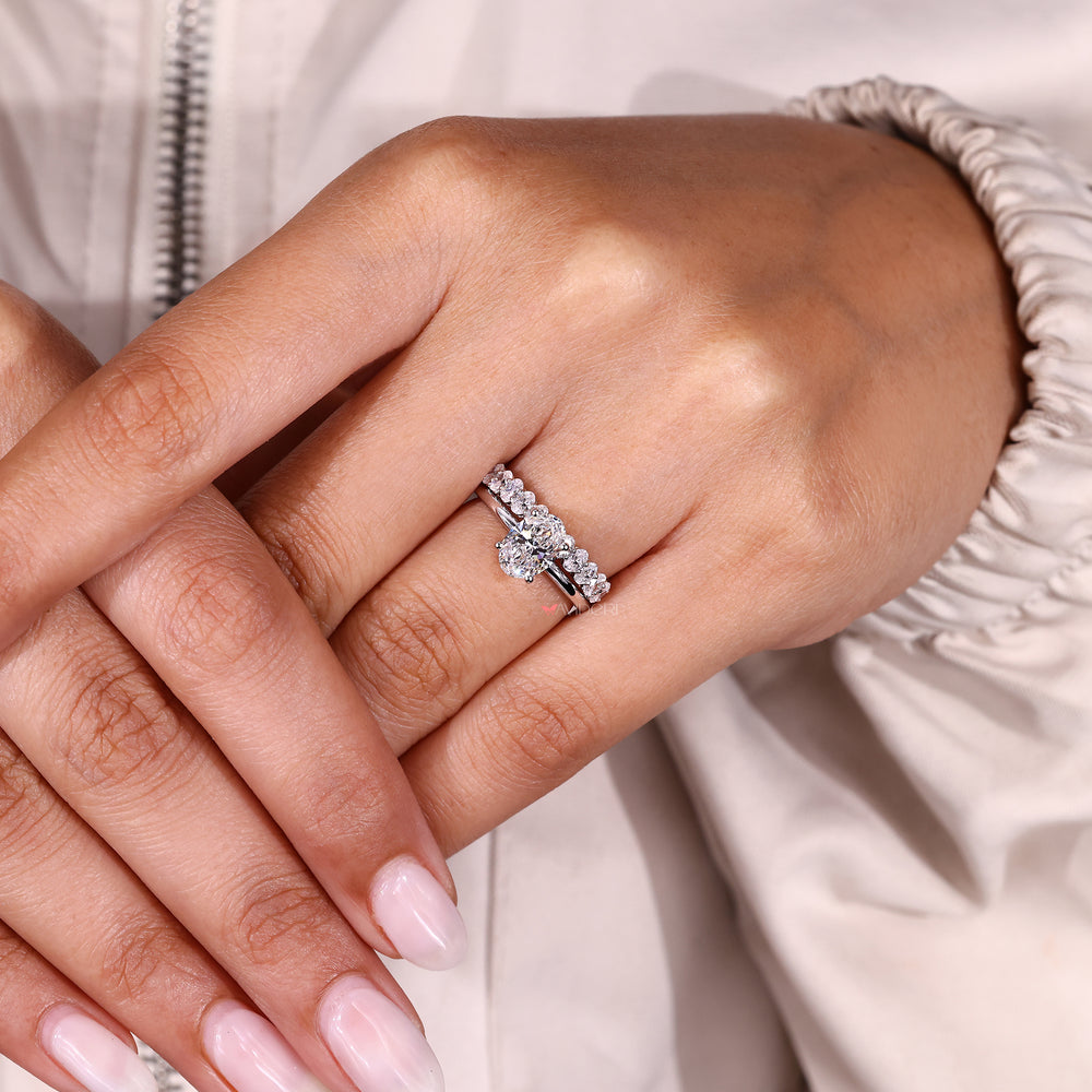 Oval diamond engagement ring with stackable band.
