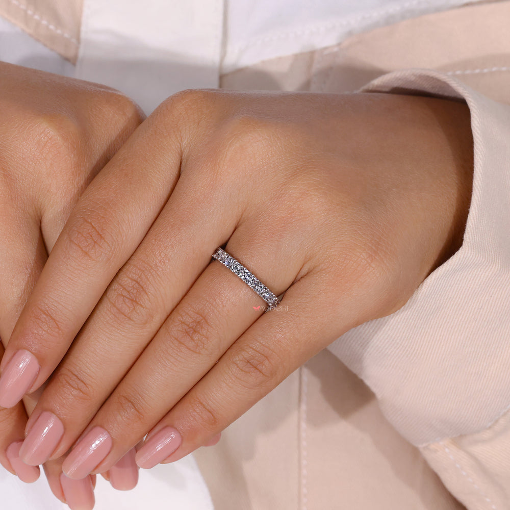 Prong setting band showing off each diamond beautifully.
