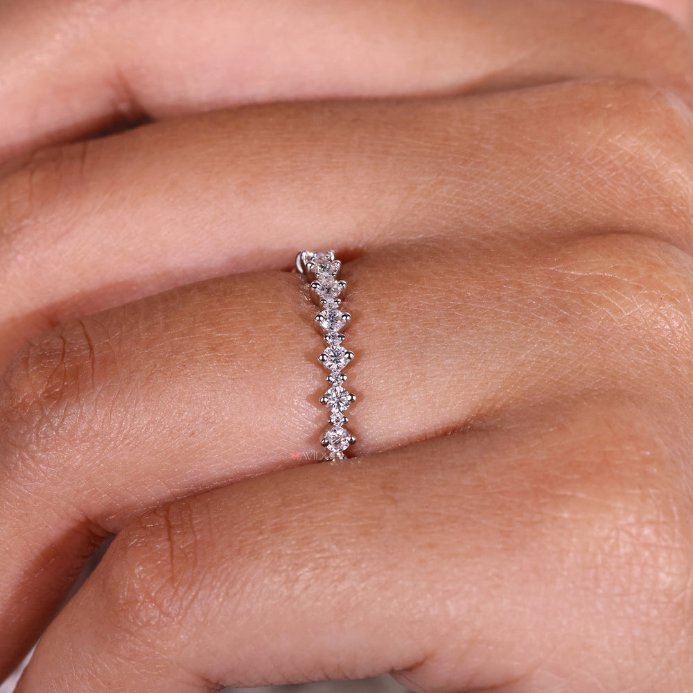 Stunning round cut diamond set in a sleek and modern wedding band design.
