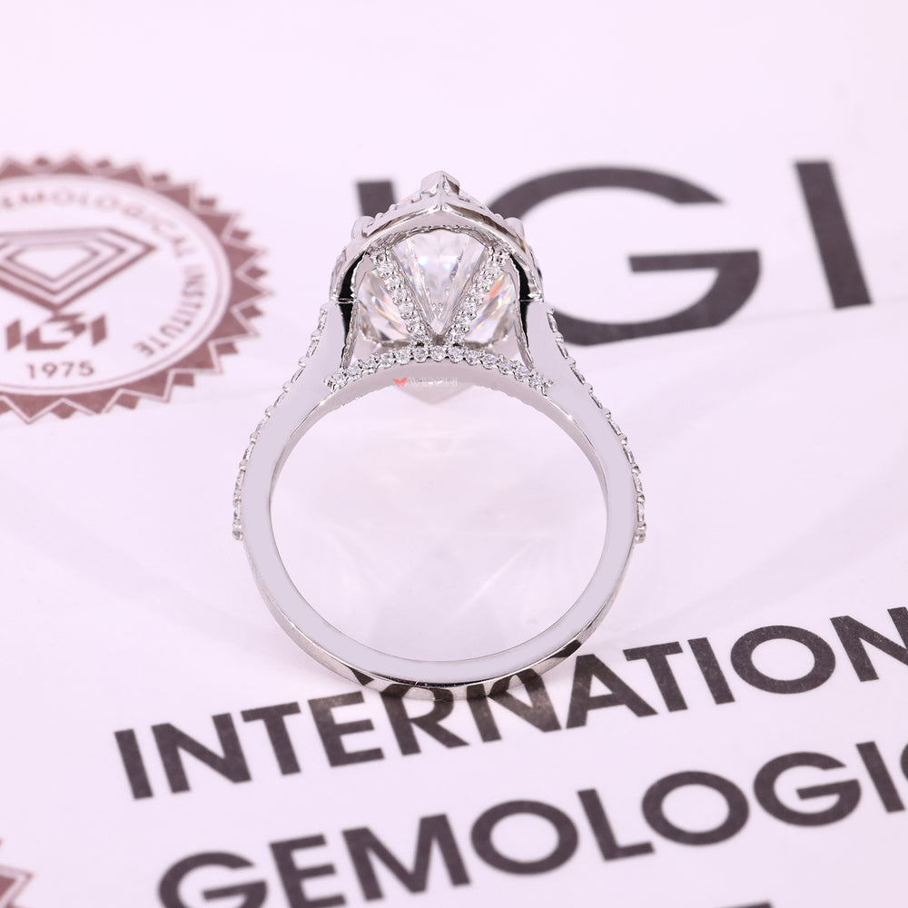 Handmade marquise engagement ring with moissanite halo.