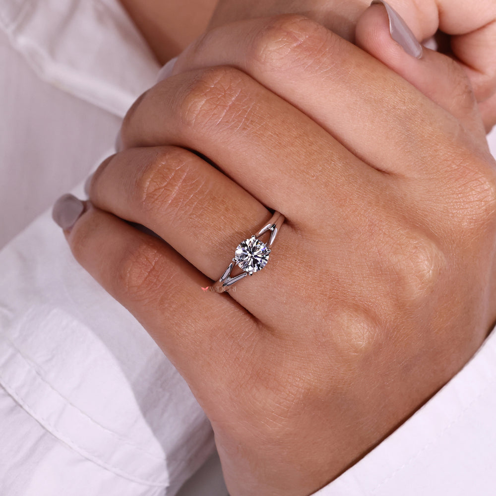 Split shank solitaire engagement ring designed with sleek lines and a sparkling diamond.
