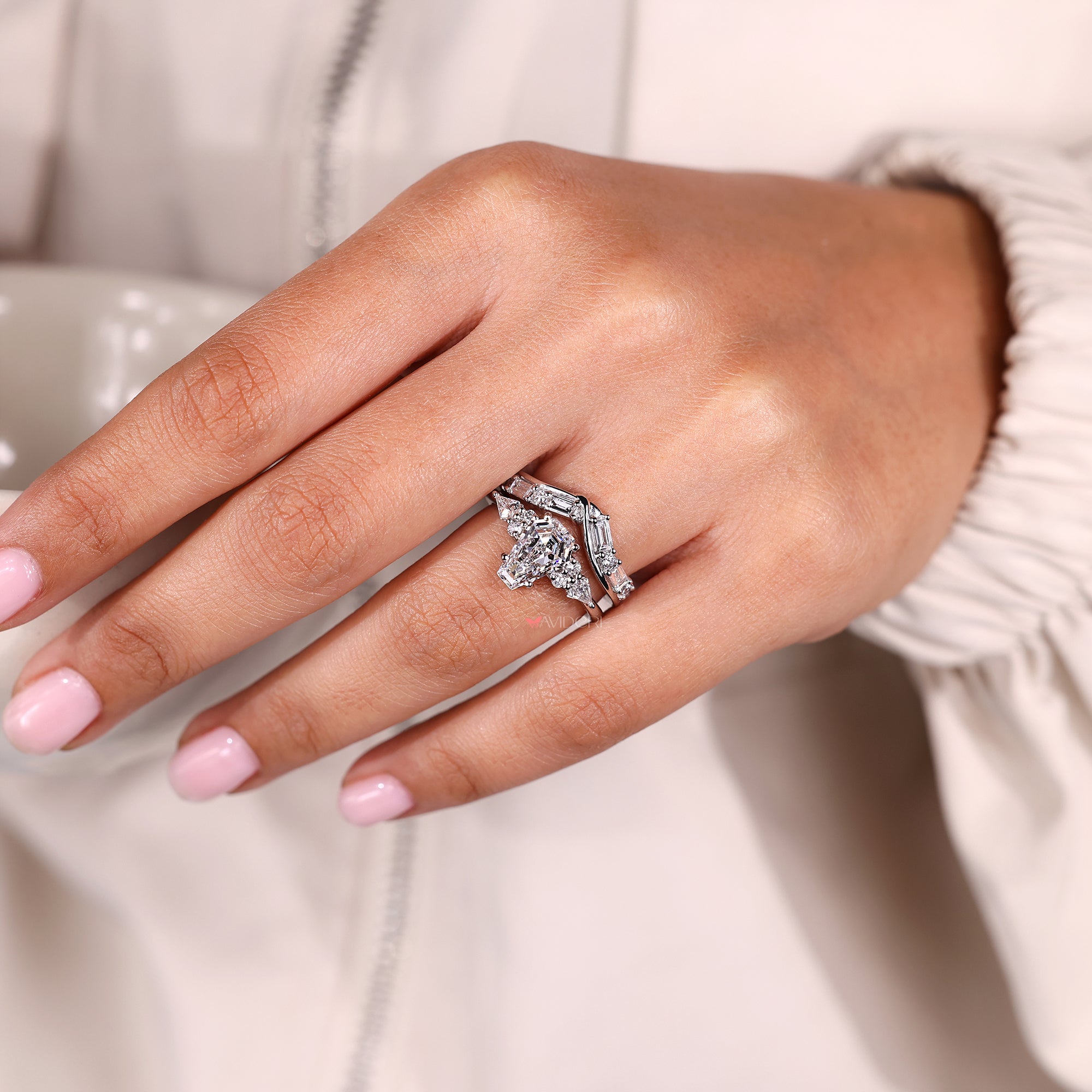 Round cut diamond ring paired with a white gold bridal set.
