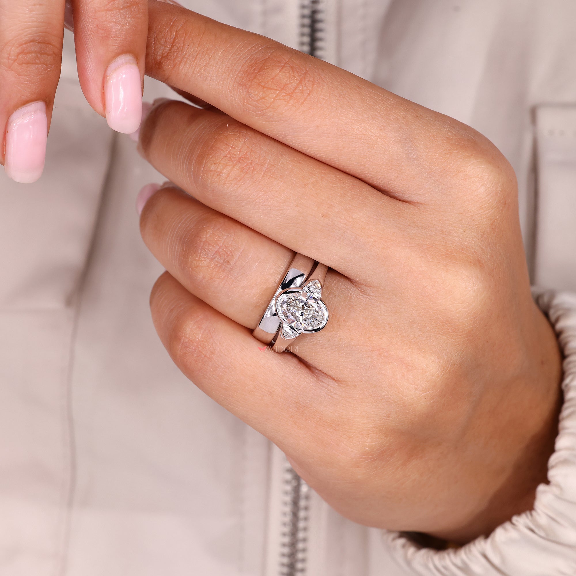 White gold bridal set with oval engagement ring.