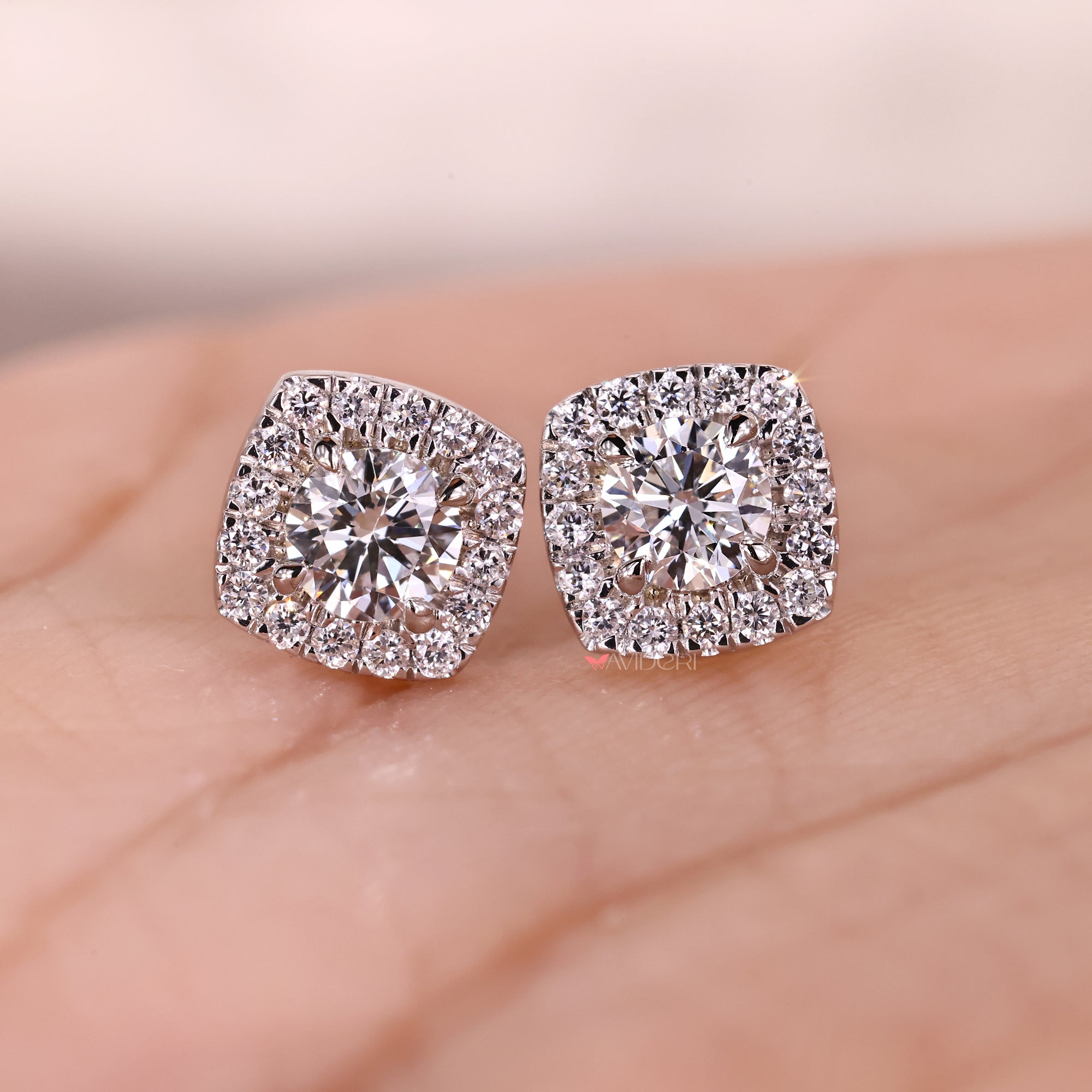 Custom earrings designed with round cut diamonds.